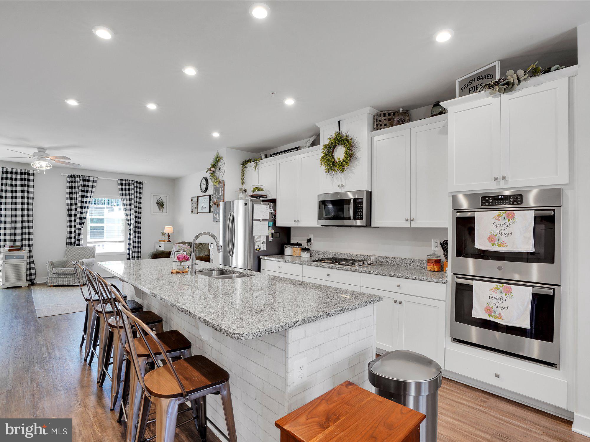 Regents Glen's  3-level townhome just minutes off I-83 in a golf course community. This beautifully maintained home has it all. The open floorplan features a large family room, Dining room, and gourmet Kitchen. The home has upgraded granite countertops, stainless steel appliances, and a large island.  The main level floors are luxury vinyl.  The 2nd floor features a master bedroom with a master bath with soaking tub and separate shower. The master bedroom also has a large walk-in closet and ceiling fan. The 2nd floor is rounded out with 2 additional bedrooms full bath & full-size laundry room with a utility sink. Enjoy the outside on a low-maintenance vinyl deck.  This home also has a 2 car garage, and instant tankless hot water heater. Schedule your showing today!
