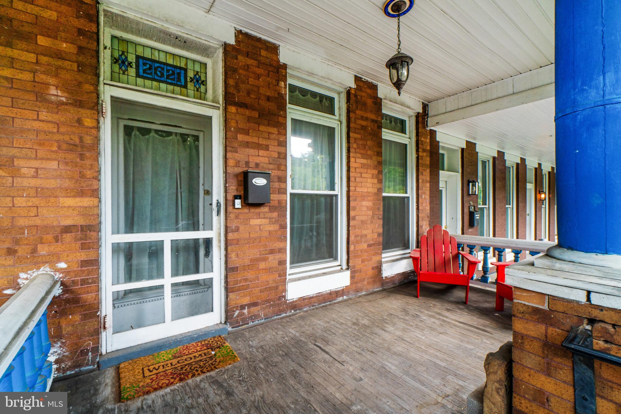 Experience the Charles Village lifestyle in this classic three-story, porch-front home. This spacious residence offers true Victorian charm combined with modern updates. Blending comfort with convenience in a highly sought-after area, this home presents a unique opportunity for sophisticated urban living. 

Notable highlights include owner owned solar photovoltaic panels, which provide clean electricity and reduce the home's carbon footprint. Regarding architecture and design, the living space offers a versatile floor plan with sunny, generous rooms. The interior features high ceilings, original hardwood floors, upgraded LVP flooring and built-ins. Additional historic details include custom molding, exquisite pocket doors, exposed brick and stained-glass windows.

Enter the home through the front vestibule where you will find a separate door providing access to the main level. The living space features a full bathroom conveniently located off the bedroom/den area, providing both comfort and accessibility. Additionally the home includes a large, separate formal dining room, which offers an excellent space for entertaining guests. The kitchen is thoughtfully designed for both culinary exploration and casual gatherings, featuring a practical peninsula that enhances counter space and provides an ideal spot for quick meals or engaging conversations while maintaining the home’s original character. Located just off the kitchen is a large, separate 6' x 5' pantry to accommodate all of your storage needs.

The second floor includes a sizable formal living room with wood built-ins, a large family room, a primary bedroom, and a full bath.

The third floor features two additional bedrooms and a full hall bathroom. This bathroom includes a walk-in shower and ceramic tiling.

The lower level of this property highlights a separate utility room and a spacious 14x35 open basement. This area serves as a clean slate, ready for you to customize and make your own.

Enjoy the welcoming porch, a perfect extension of the living space for quiet mornings or relaxed evenings. The property offers excellent outdoor space and parking, including both front and back yards. There is a separate one-car brick garage equipped with a remote and extra storage space. Additionally, there is ample public parking available on the beautiful, one-way tree-lined street.

This property presents a compelling vision of Baltimore living; arrange your private viewing today to experience its charm firsthand. Located on a quiet block, this home is convenient to Johns Hopkins University, Penn Station, Union Memorial Hospital, the Baltimore Museum of Art, local shops, restaurants, coffee shops and nearby Remington attractions.