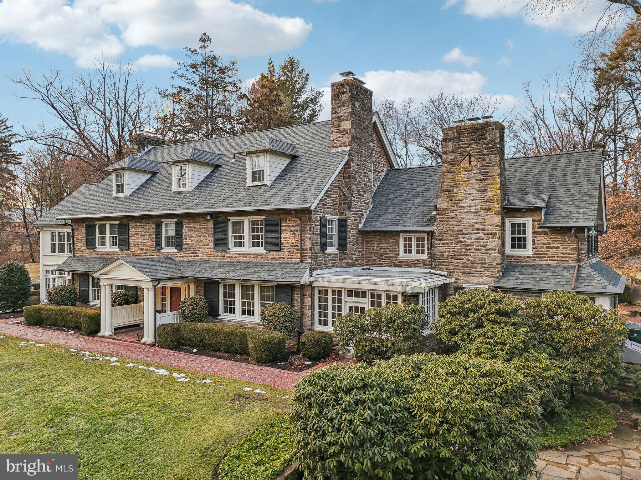 Timeless Luxury in Rydal/Meadowbrook – Stunning Stone Colonial on 1.9 Acres

Welcome to a truly exceptional estate in the prestigious Rydal/Meadowbrook neighborhood. Set on 1.9 acres of professionally manicured grounds, this all-stone colonial is a masterpiece of timeless elegance and craftsmanship, offering unparalleled charm, grandeur, and modern comfort.

Arriving at the home, you are greeted by a stately circular driveway leading to an impressive center hall entrance with grand foyer , setting the stage for the breathtaking interior. With six fireplaces, intricate dental crown molding, and exquisite woodwork throughout, this residence offers the perfect blend of old-world charm and sophisticated living.

Gracious Living & Entertaining Spaces
The formal living room, formal dining room each featuring their own fireplaces, creating warm and inviting spaces perfect for gatherings. When your looking to relax and fell like your outside, enjoy the 4 season sunroom located off the living room that is bright with windows galore and fireplace. The large gourmet eat-in kitchen is a chef’s dream, boasting tons of cabinet and countertop space, seamlessly flowing into an entertainment room  with fireplace, built in banquette dining area and connecting to an adjacent breakfast room with tons of character & windows. Off the entertainment room there is  direct access to multiple brick patios and serene gardens.

Luxurious Bedroom Retreats
With six-plus bedrooms, this home offers plenty of space for relaxation and privacy. The primary suite is a true sanctuary, featuring a  library/sitting room with Cherry wood finishes & built-ins, two full baths, and a private dressing room. Several additional bedrooms also include their own fireplaces coupled with a back staircase leading to the kitchen area adding to the home's unique and elegant character.

Lower-Level Entertainment Haven
The finished basement is a world of its own, designed for entertainment and recreation. It includes a custom-built bar and built-in seating area, with plenty of space for game tables, a media lounge, and more—a perfect setting for hosting guests or unwinding in style.

Expansive Grounds & Timeless Elegance
This estate’s lush, sprawling grounds offer endless possibilities for outdoor enjoyment, whether it’s entertaining on the brick patios, strolling through the landscaped gardens, or simply soaking in the beauty of this private retreat.

A Rare Opportunity in a Coveted Location
Located in one of the most sought-after communities in Montgomery County, Rydal, this home offers a perfect balance of privacy and convenience, just minutes from fine dining, shopping, top-rated schools, and major commuter routes & trains.

This is more than just a home—it’s a legacy property with unparalleled craftsmanship and grandeur. Don’t miss this rare opportunity to own a piece of Rydal/Meadowbrook’s finest real estate. Schedule your private tour today! Don't wait!!