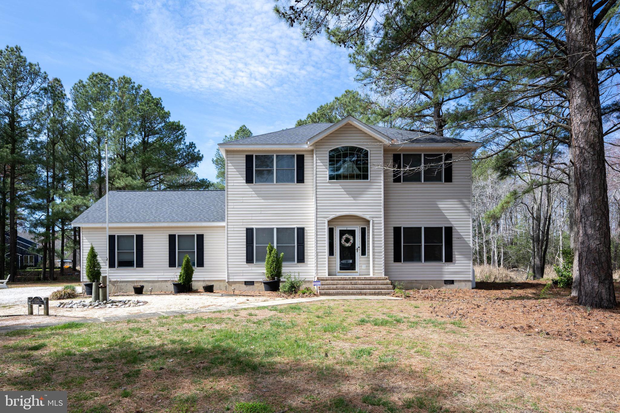Welcome to your waterfront 1.35 acre retreat in Holiday Harbor—where coastal charm meets everyday comfort. This beautifully maintained 4 bedroom, 2.5-bath home offers the perfect blend of relaxed living and functional space. From the moment you step inside, you’ll appreciate the light-filled interiors, open flow, and thoughtful layout designed for both entertaining and quiet evenings at home. The spacious main living area invites you to unwind while enjoying serene water views. The well-appointed kitchen offers ample cabinetry and counter space, making meal prep effortless whether you're hosting guests or enjoying a quiet dinner in. The adjoining dining area provides the perfect setting for gathering with family and friends. Upstairs, the primary suite serves as a private retreat, complete with an en-suite bath and generous closet space. Two additional bedrooms provide comfort and flexibility for family or guests. A versatile den adds even more value—ideal as a home office, playroom, or easily converted into a 5th bedroom to suit your needs. Step outside and experience the true highlight of this property: direct boat access to the Saint Martins Neck River. Whether you enjoy early morning fishing trips, sunset cruises, kayaking, or simply soaking in the peaceful waterfront setting, this home makes it all possible right from your backyard. With its prime waterfront location, flexible living space, and easy access to the river, this Holiday Harbor gem offers the lifestyle you’ve been dreaming of. Don’t miss your opportunity to make it yours.