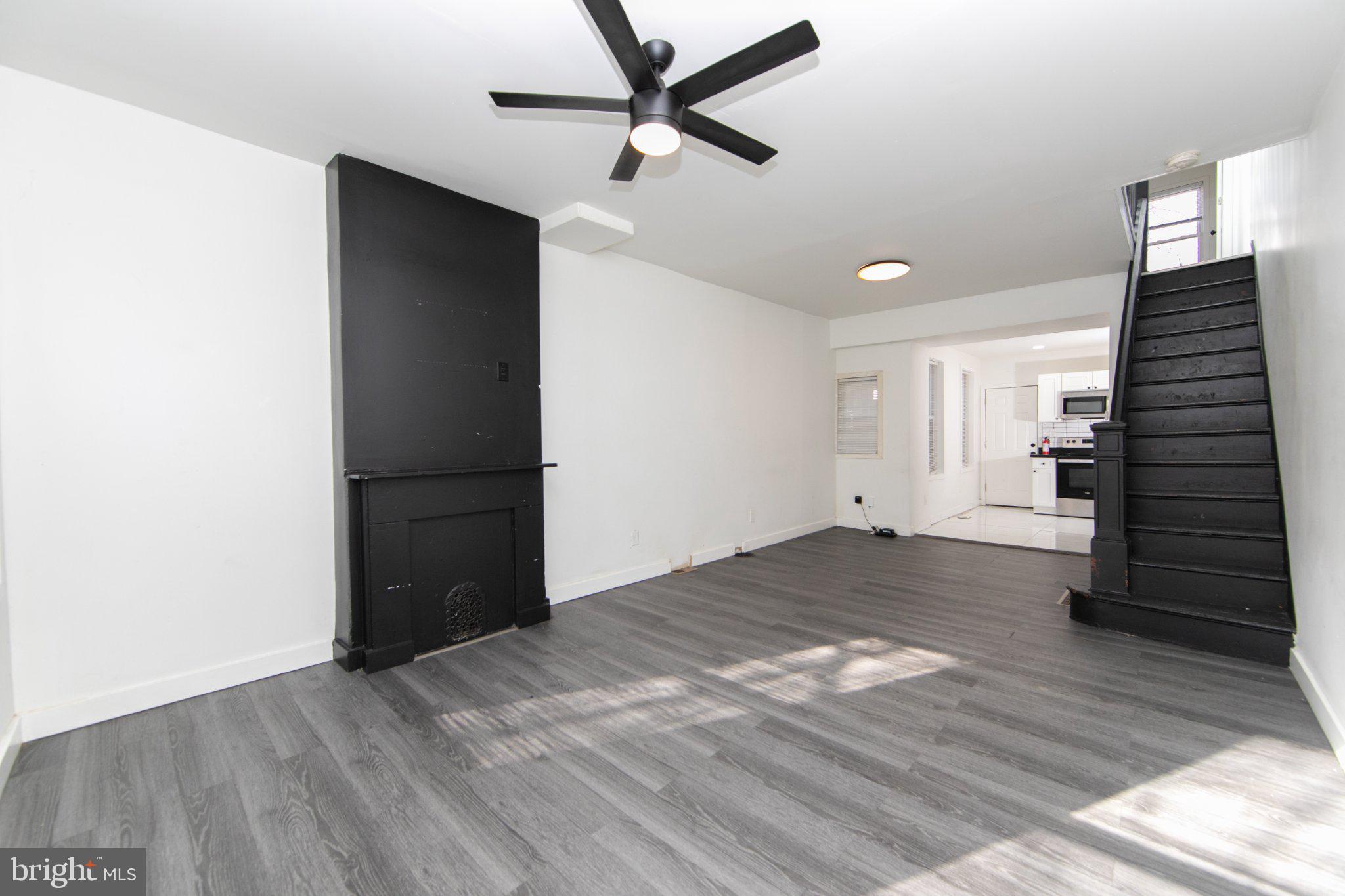 Welcome to 2526 N Jessup Street, a stylishly updated property in Philadelphia that was renovated in 2022 and designed with a sleek black-and-white modern aesthetic throughout. The kitchen features contemporary white cabinetry, granite countertops, and large white ceramic floor tiles that create a bright, clean look while offering durability and easy maintenance. The living room and front bedroom both showcase bold black accent walls that complement the home’s modern theme and add a unique design element. The exterior has also been refreshed with white paint and black accents, providing attractive curb appeal that mirrors the interior style. With its recent renovation and low-maintenance finishes, this property presents an excellent opportunity for investors seeking a turnkey rental with minimal work required, making it ready to generate income in today’s market.