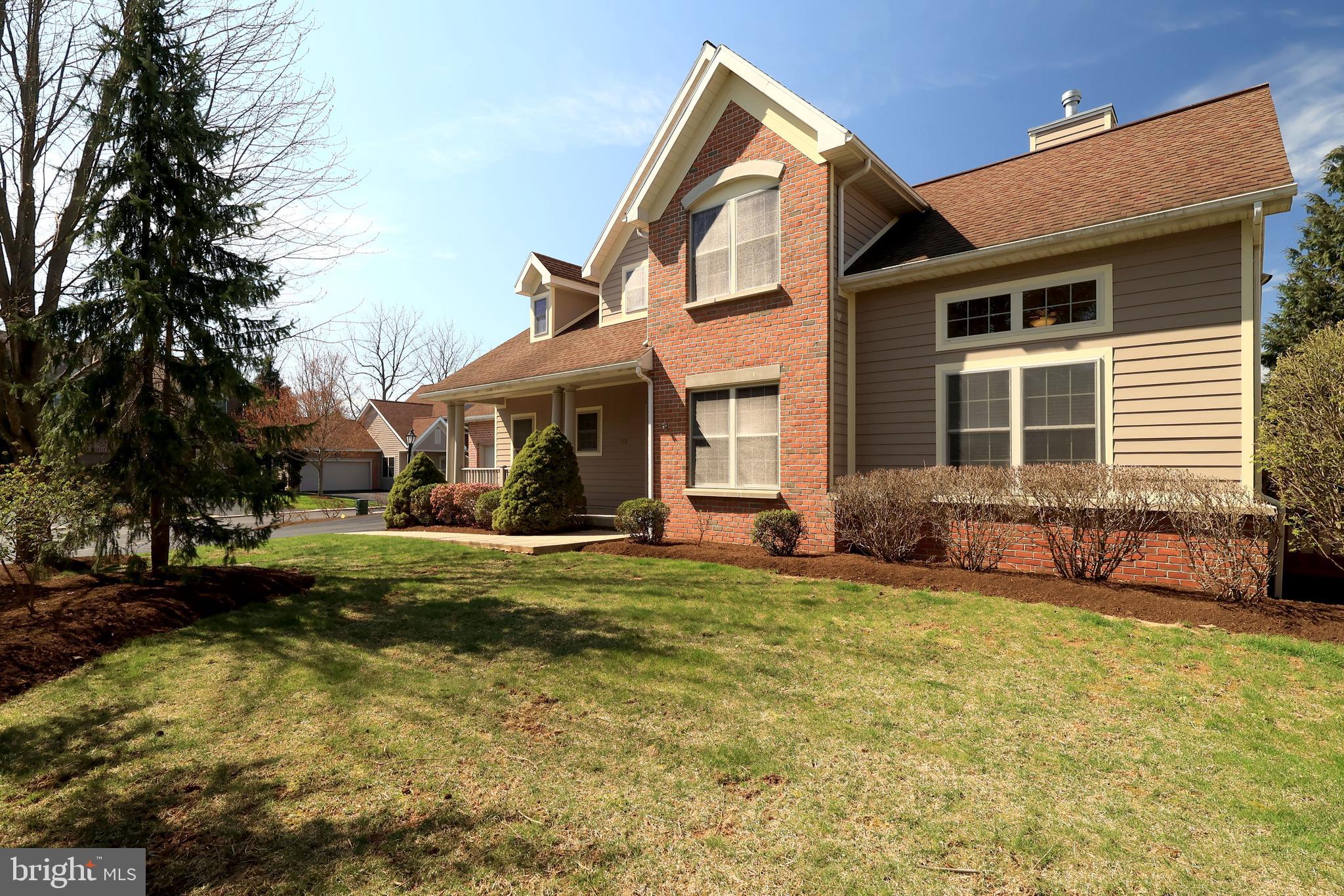 You'll love easy living at The Hamlet in this beautiful 2 story single family home that features all of the convenience of condo living with snow removal and landscaping included! HardiPlank siding and brick adorn the exterior of the home and a charming front porch welcomes you into the open foyer with coat closet. A fusion of traditional and open floors plans, you'll enjoy the bright and airy feel of the open concept living room and dining room! This welcoming space features hardwood floors, a gas fireplace with lovely wood mantle and built-in bookcases, high vaulted ceilings in the living room, door to the side deck, and a beautiful two toned decorative chair rail in the dining room where you'll love sharing meals with your favorite people. The sweet kitchen has granite countertops, tile backsplash, SS appliances, gas stove with hood, lovely wood cabinetry and floors, a pantry closet, and a breakfast nook perfect for your first cup of morning tea! Working from home? You'll love the great main level office with vaulted ceilings, abundant bookshelves, and French Doors. At the end of a long day, retreat to your private primary suite with a serene bedroom, walk-in closet, and private bath with jetted tub, dual vanity, ceramic tile floors, and a walk-in shower. A half bath and laundry room complete the main level allowing for one floor living! Upstairs you'll discover a versatile open family room great for cozying up with a good book or playing board games on a rainy afternoon. You'll also find two nicely sized additional bedrooms with WICs and shared bath with tub/shower combo and tile floors! The pre-plumbed with egress window lower level provides great opportunity for storage or could be finished for additional space and features high ceilings, a superior wall foundation, pex water lines, water softener, and radon mitigation. You'll appreciate the 2 car garage and the natural gas heating and central air. Spend sunny afternoons with a lemonade on the charming deck or enjoying the neighborhood walking/biking paths. This neighborhood is near golfing, shopping, and restaurants and is a quick commute to campus. The COA fee includes: mowing, snow removal, landscaping, deck maintenance, and water. For extra peace of mind, Sellers are providing a one year HSA Home Warranty! With lovely features and convenience you'll feel right at home in no time!
