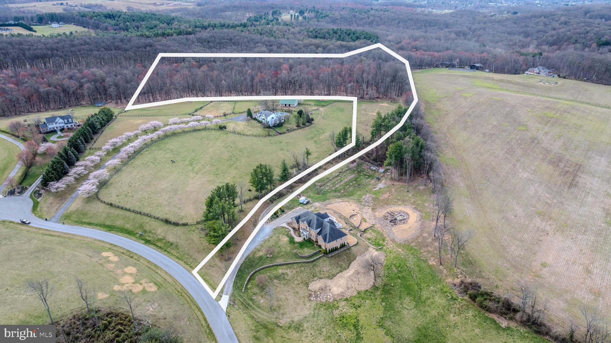 This gorgeous 18 acre lot wooded lot could be the site of your future dream home. Beautiful mature forest. The 7 gallon per minute well is in place, and it is perk approved for 4 bedrooms. Ready to build! Situated in an area of upscale housing, the house location offers quiet privacy. This is truly a once in a lifetime opportunity.
There is fee simple access to the lot over a shared driveway. The driveway maintenance agreement is spelled out on the plat. Please respect the neighbors privacy and don't drive back to the lot without showing permission. Conveniently located close to shopping, restaurants and commuter routes.  This property feels remote, yet is close to everything. House/lot packages available with one of our preferred builders or bring your own builder.
The current proposed path of the Maryland Piedmont Reliability Project crosses the southeast corner of this lot.  It is currently expected that MPRP will desire a right-of-way across the property. Buyer is responsible to perform due diligence as to what that might look like. Please consult the website for MPRP.