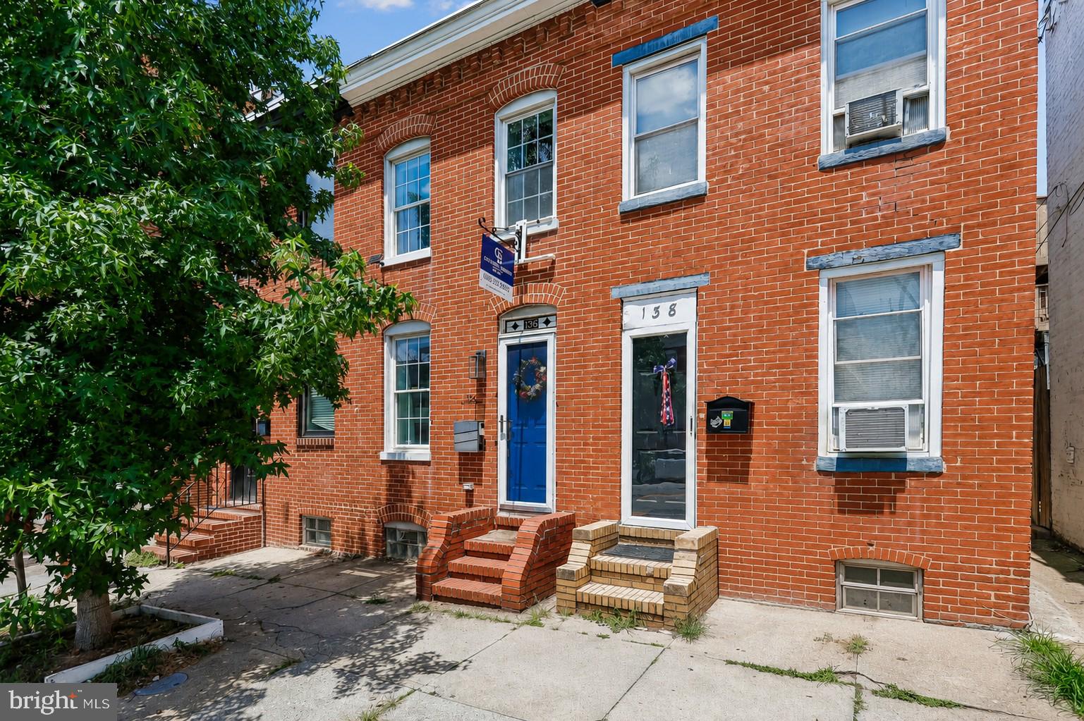 Recently renovated and bursting with historic charm, this stunning 2-bedroom, 2.5-bathroom Federal Hill townhouse offers the perfect blend of classic Baltimore character and modern luxury. The open-concept main level welcomes you with gorgeous hardwood floors, exposed brick, and recessed lighting. The seamless floor plan flows into a bright kitchen featuring stainless-steel appliances and an adorable breakfast bar for two. The adjacent dining area easily accommodates an oversized table, complemented by a convenient main-level powder room.

Upstairs, you will find two generously sized bedrooms and two full baths. The primary suite serves as a private retreat, boasting a vaulted ceiling, an exposed brick accent wall, and more than ample closet space. Exceptional outdoor living awaits with two distinct entertainment areas: a private backyard patio with an awning, and a huge deck off the rear bedroom. A large basement provides excellent storage space. Highly coveted parking spot right outside your backyard is available for rent.

Nestled in a vibrant neighborhood, you are just a short distance from Riverside Park, the Inner Harbor, and the Ravens and Orioles stadiums. Commuting is a breeze with quick access to I-95 and the MARC train. Imagine your new home and schedule a tour today!