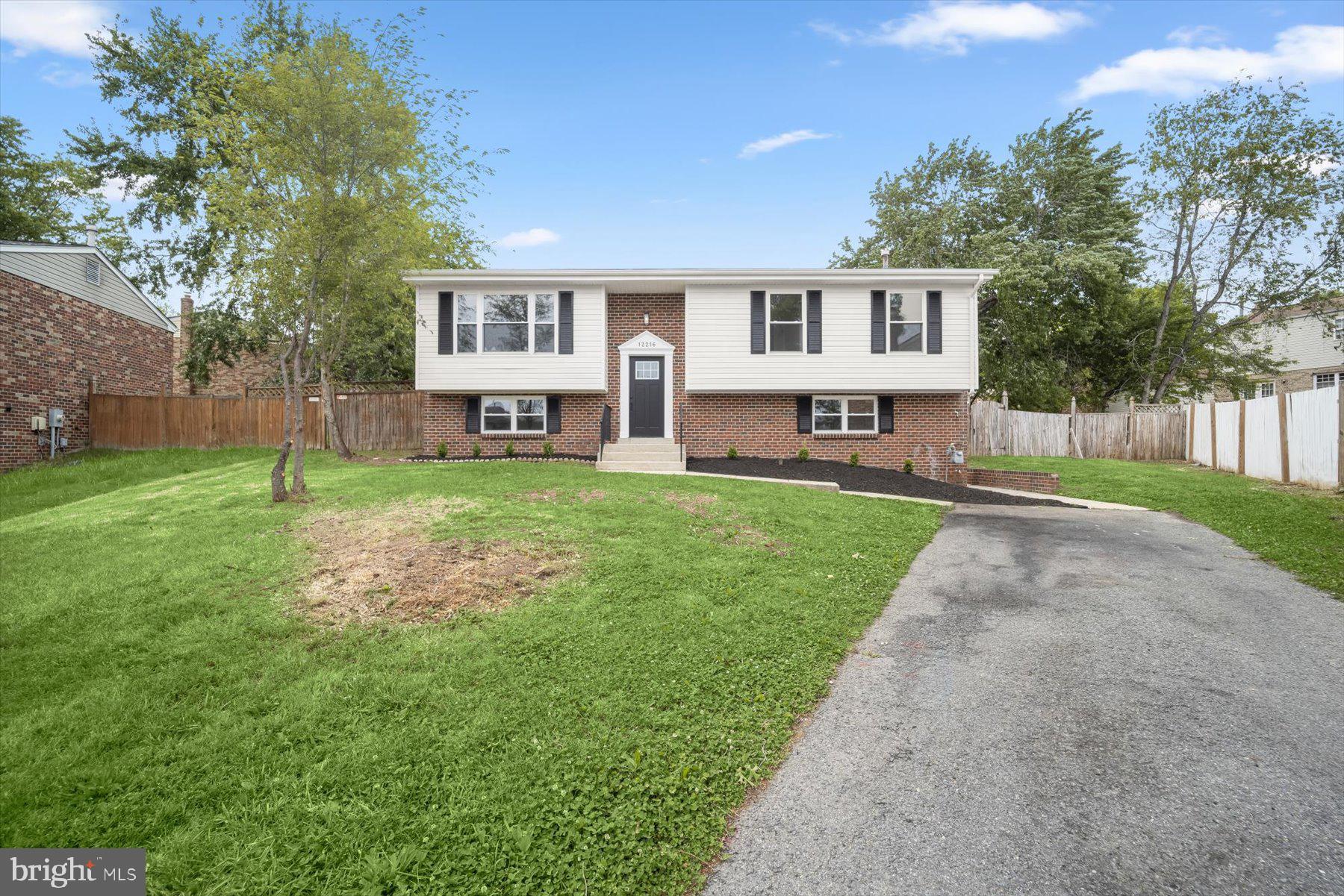 Welcome to your beautifully renovated dream home in Clinton! This spacious 5-bedroom, 3-bath split foyer welcomes you into a bright, open space with a living room that flows seamlessly into the dining area and gorgeous kitchen. The kitchen is the centerpiece of the home, featuring quartz countertops, a waterfall island, premium stainless steel appliances, and custom cabinetry with designer finishes. Walk down the hall to three generously sized bedrooms, including a private primary suite with its own full bathroom, along with an additional full hallway bath. The fully finished lower level provides incredible flexibility with two additional bedrooms, a full bathroom, and a large living area that is ideal for guests, a home office, or extended living space. Enjoy outdoor living with a spacious deck overlooking the backyard and the convenience of a private driveway. With thoughtful updates throughout, this home is truly move-in ready. Conveniently located with easy access to major commuter routes, shopping, and dining. Schedule your showing today!