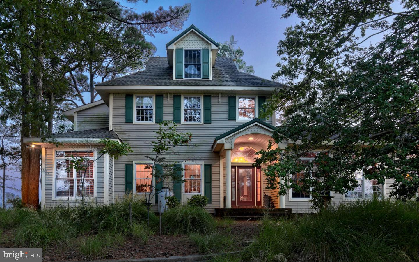 Experience the best of coastal Delaware living at this extraordinary waterfront estate, set on more than 4 private acres along the stunning Rehoboth Bay. This one-of-a-kind property offers unmatched privacy, breathtaking views, and endless possibilities for year-round living, a vacation retreat, or an investment opportunity.

The main residence features 4 spacious bedrooms and 3.5 bathrooms, with light-filled living spaces designed to capture panoramic bay views from nearly every angle. Expansive windows invite the beauty of the outdoors in, creating a warm and inviting atmosphere perfect for both everyday living and entertaining.

Step outside and discover your own private waterfront sanctuary. Enjoy direct bay access from your private dock, soak in spectacular sunsets, and embrace the natural beauty that surrounds you. Watch bald eagles soar overhead while deer and other wildlife roam the grounds, all from the comfort of your patio or porch as refreshing bay breezes drift by.

Adding even more value and versatility, the property includes a charming carriage house above the oversized 3-car garage—ideal for hosting guests, creating a private home office, multigenerational living, or generating rental income.

Rarely does a property offer this combination of acreage, waterfront access, privacy, wildlife, and proximity to Rehoboth Beach. Whether you're seeking a luxury primary residence, a coastal getaway, or an income-producing retreat, this exceptional bay front property delivers a lifestyle few can match.

Listing agent to provide 1 year Home Warranty to buyers. Listing agent will also have home professionally power washed and interior cleaning after closing.