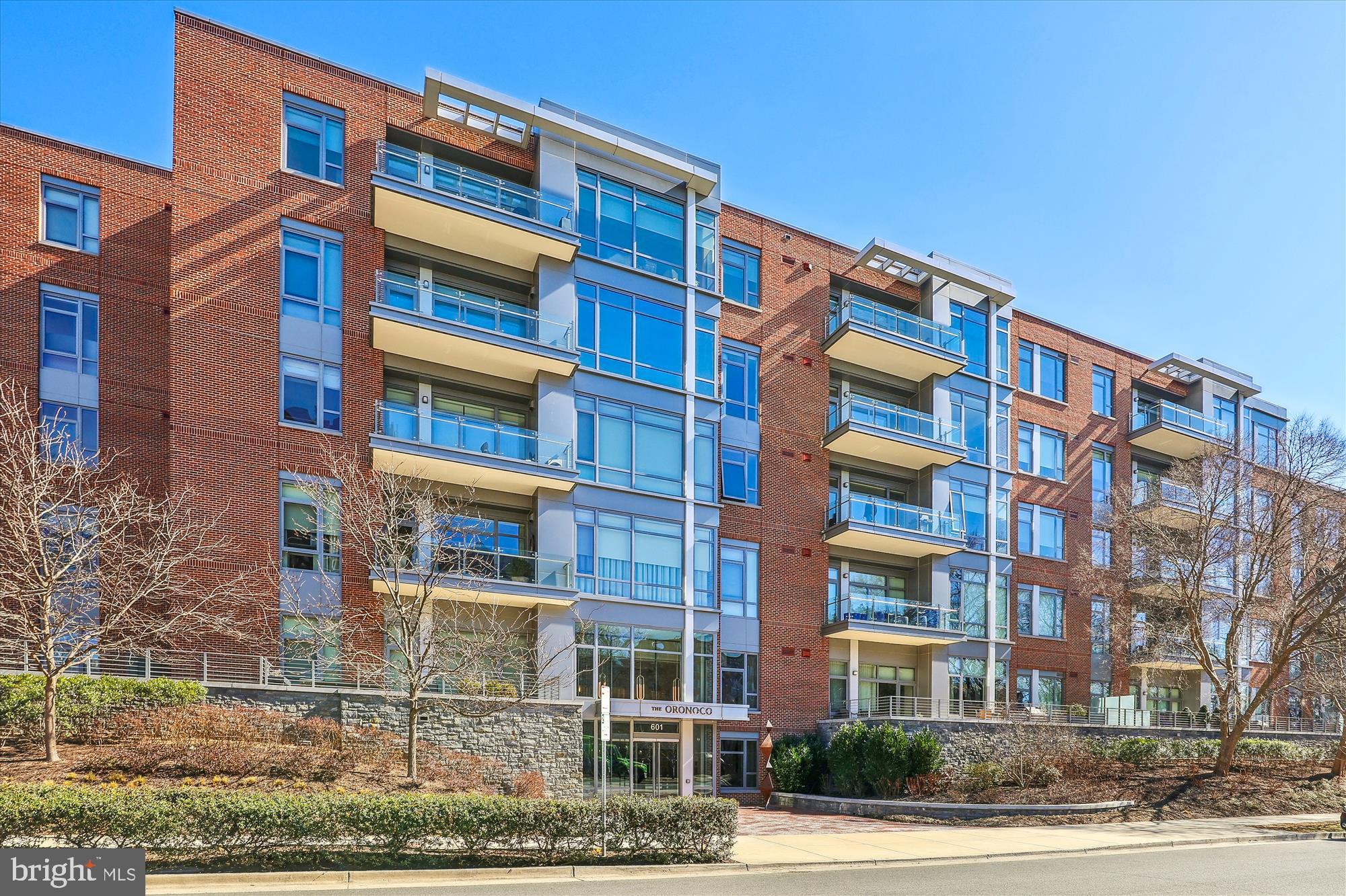 Open house has been cancelled. Welcome to #407 at The Oronoco, an exquisite 2-bedroom, 2.5-bathroom condominium located in the heart of Old Town. This luxurious 2,427-square-foot residence offers an unparalleled living experience in one of the area's most coveted properties.  Upon entry, you are greeted by floor-to-ceiling windows that flood the space with natural light, creating a warm and inviting ambiance. An expansive gourmet kitchen with large island is equipped with top-of-the-line appliances and seamlessly flows into the den and spacious living room with gas fireplace. All north facing windows offer river views, adding a touch of tranquility to your living experience. The open layout is ideal for both intimate and larger gatherings. Gleaming refinished wood floors add warmth throughout.  The primary bedroom suite serves as a private retreat, complete with two walk-in closets and a luxurious bath with separate soaking tub and shower, providing a relaxing space to unwind. The second bedroom is equally well-appointed, offering comfort and privacy for guests.  Residents of this prestigious building enjoy a range of amenities, including 24-hour concierge service, a fitness center, yoga studio, a dog washing station, heated pool, storage (#42), club room, a children's playroom and bike storage. There are also two garage parking spaces (#'s 103,104). The property is adjacent to the bike path and just blocks away from shopping and local restaurants, and minutes to the airport.  All of this makes it an ideal location for those who value both convenience and an active lifestyle.
