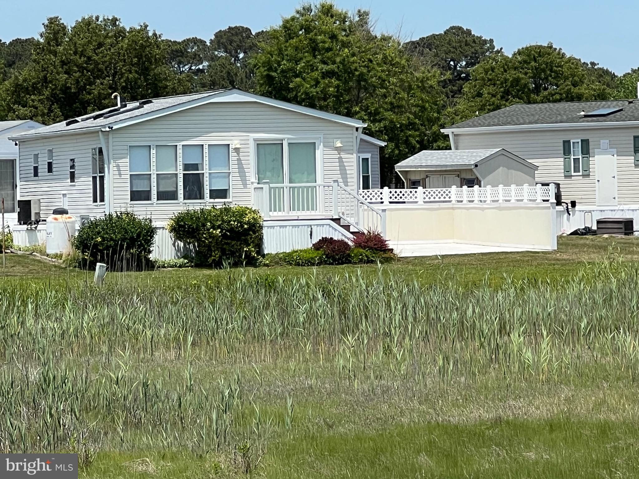 Bayfront with Spectacular Panoramic Views of Bay, Assateague & 1000ft. Pier!  Turn Key Fully Furnished 3 Bedroom on an Extra Large Lot.  Updates include; Roof, Water Heater, HVAC, Maintenance Free Composite Steps & Vinyl Railing, Washer/Dryer. Courtyard & Shed.