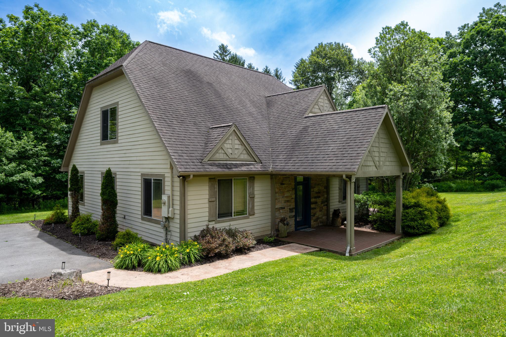 Nestled in a private, peaceful setting within the desirable Northlake Village community, this stunning 5-bedroom, 3.5-bath home offers the perfect combination of comfort, space, and convenience. Located in the center of the Deep Creek Lake area, you'll enjoy easy access to year-round recreation, dining, shopping, and outdoor adventures. Featuring over 2,520 square feet of living space, this home provides plenty of room for family and friends to gather. The spacious layout includes a large family room, a wet bar ideal for entertaining, and multiple areas to relax and unwind. Step outside to enjoy the outdoor patio with a hot tub, gather around the fire pit on cool evenings, or simply take in the tranquility of the private wooded setting. Just a short drive from Deep Creek Lake attractions and Wisp Resort, this property is perfectly positioned for boating, skiing, hiking, and all-season enjoyment. Whether you're seeking a primary residence, vacation getaway, or investment property, this exceptional home offers the best of Deep Creek Lake living.