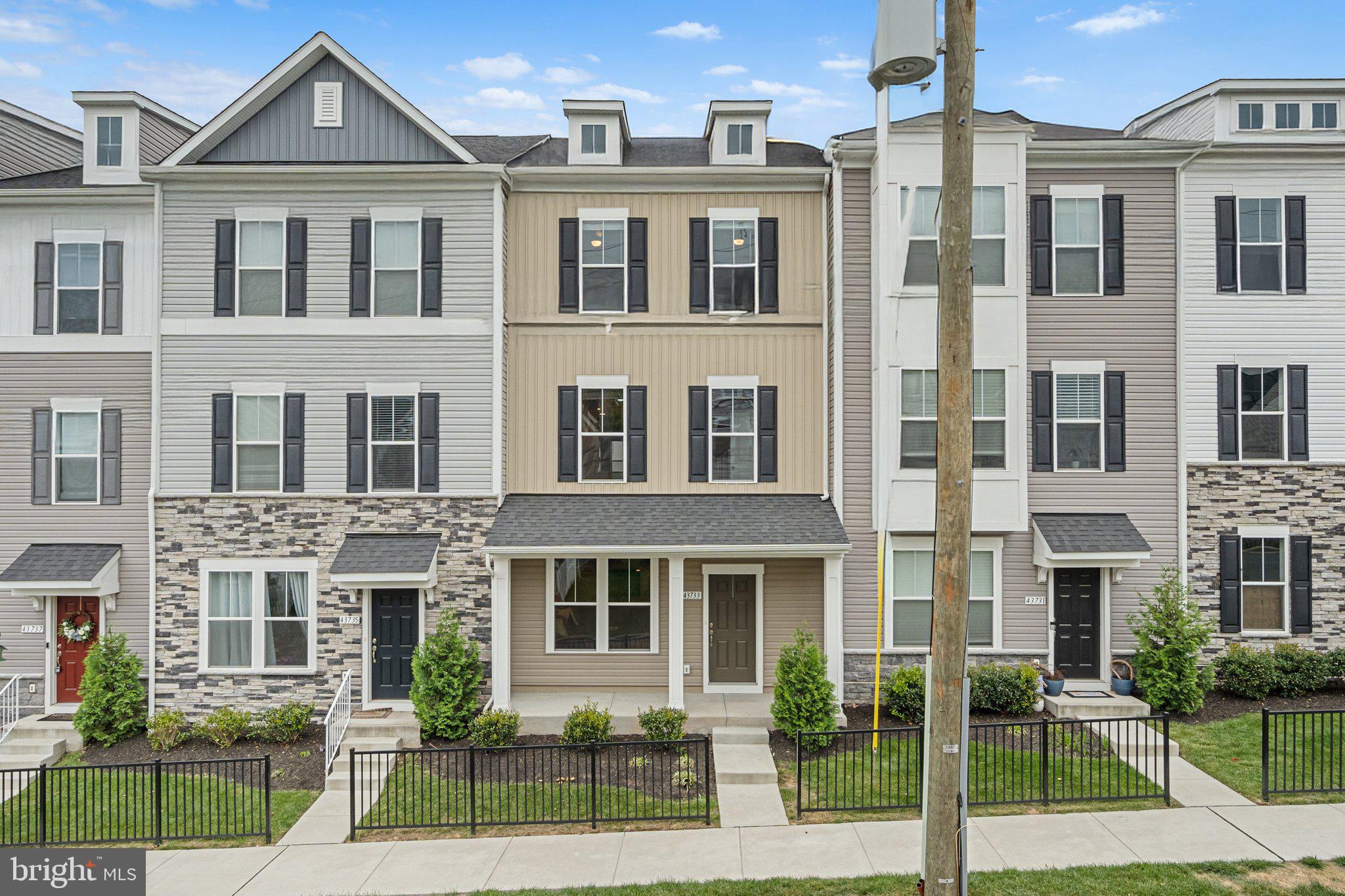 Don't miss this beautiful, nearly-new home in Old Town Ashburn! 3BR/3.5 BA with tons of upgrades and an 8' extension on the back. Gorgeous chef's kitchen with upgraded cabinets, appliances, quartz counters and a huge island, perfect for entertaining.  Primary suite features a stunning bathroom, sitting room, huge closet and a private, covered porch. Two additional upstairs bedrooms share an upgraded hall bath. Upstairs laundry room and lots of closet space. Lower level features large recreation room with a full bath. LVP throughout lower and main levels.  Huge garage with room for storage. Conveniently located steps from the W&OD trail, shopping, and a wide variety of dining options. This home is pristine and move-in ready. Per builder, actual square footage is 2315.