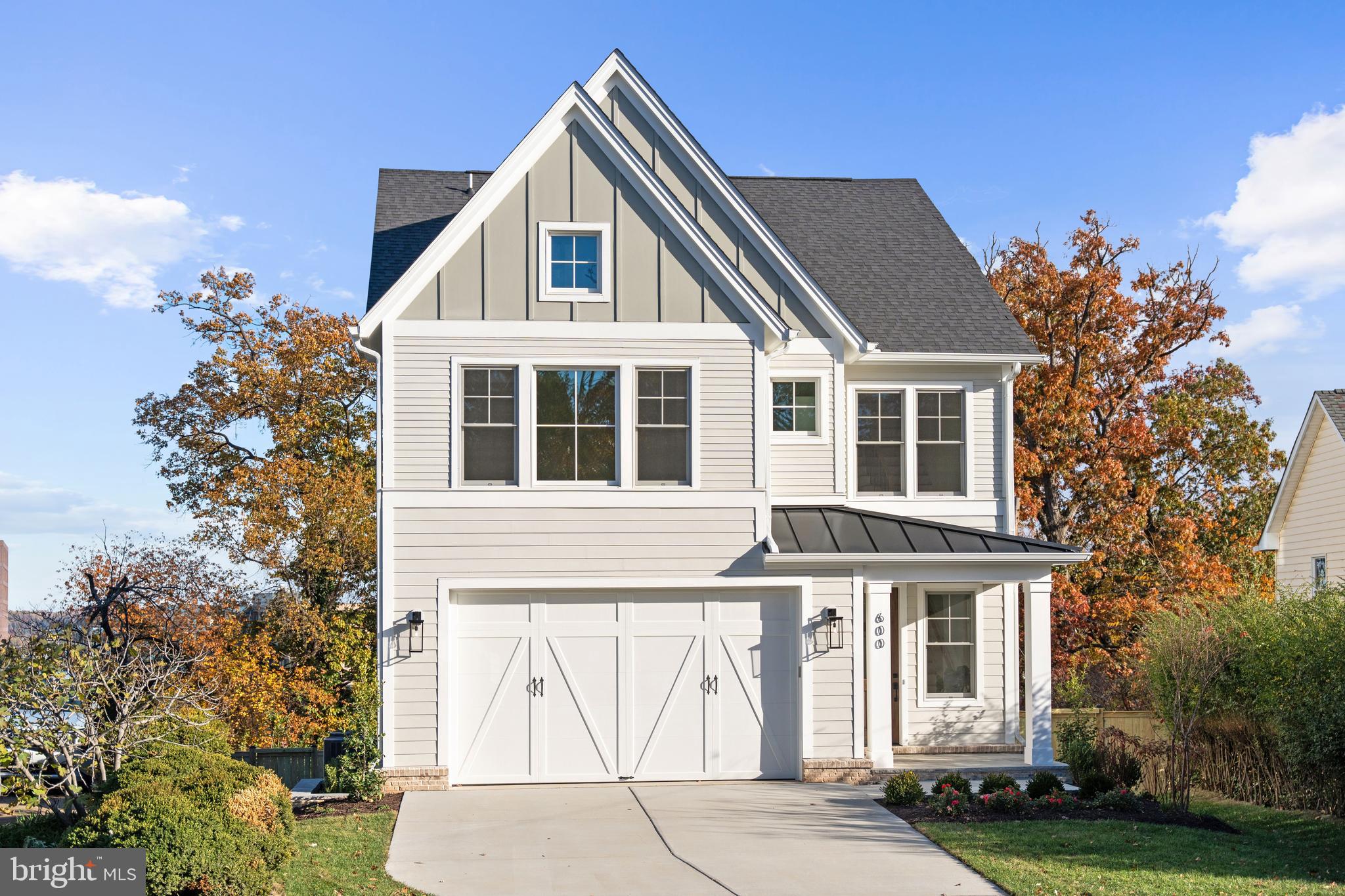 **Builder Financing Incentives Available. Limited-time offer.  Terms and conditions apply.**
Move-in Ready! A stunning new custom home by Classic Cottages, perched on a hilltop in Arlington’s sought-after Oakcrest neighborhood with sweeping views of National Landing.
WHAT MAKES THIS HOME STAND OUT?
This beautifully crafted residence blends modern design with timeless elegance, offering a layout that lives as well as it looks. The open-concept main level is designed for everyday comfort and effortless entertaining, highlighted by soaring 10' ceilings on the main level, wide-open sightlines, and abundant natural light.
The gourmet kitchen is a true showstopper, featuring upgraded cabinetry, upgraded quartz countertops, a large center island, and premium Thermador appliances, creating a space that’s equally suited for weeknight dinners or hosting a crowd. The kitchen flows seamlessly into the great room with a cozy gas fireplace and opens to a private patio — perfect for morning coffee, al fresco dining, or evening cocktails.
This home is built for comfort, efficiency, and long-term performance with a three-zone variable-speed high-efficiency heating and cooling system, premium Ply-Gem windows, and CertainTeed Landmark architectural shingles. Solid-core 8' and 7' doors throughout the home add to the upscale feel, while 220V electrical wiring in the garage provides easy future-ready car-charging.
Upstairs, the luxurious primary suite offers a spa-inspired bathroom and expansive walk-in closet, while two additional ensuite bedrooms with walk-in closets provide comfort and privacy. A convenient laundry room completes this level.
The upper loft level features a fourth bedroom, full bath, a bright lounge area with wet bar, and access to a private rooftop deck with sweeping views of National Landing and beyond — your new favorite sunset spot.
The fully finished lower level adds even more flexibility with a large recreation room, a bonus space perfect for a gym or home office, and a fifth bedroom with a full bath ideal for guests or multigenerational living.
A two-car garage, thoughtful storage, custom finishes throughout, and a Builder’s Warranty included complete this exceptional, move-in-ready home.

WHAT MAKES THIS LOCATION STAND OUT?
Ideally located near Crystal City and National Landing, this home offers exceptional walkability to neighborhood favorites including Commonwealth Joe Coffee Roasters, Makers Union, and Whole Foods. Enjoy effortless access to dining, coffee shops, and everyday conveniences just steps from your door. Outdoor lovers will appreciate nearby Long Bridge Park, Virginia Highlands Park, and the scenic Mount Vernon Trail along the Potomac, offering miles of walking and biking paths, open green space, and river views. A rare opportunity to enjoy a truly walkable lifestyle with easy access to both vibrant city amenities and beautiful outdoor spaces.

ABOUT THE BUILDER
Classic Cottages is a premier Northern Virginia custom home builder with more than 15 years of success and a reputation for quality, consistency, and exceptional client service. As a fully integrated firm, Classic Cottages manages every stage of the process — from land acquisition and architectural design to construction and warranty — ensuring a seamless and transparent experience. Buyers have the flexibility to build fully custom, personalize a semi-custom plan, build on their own lot, or purchase a move-in-ready home. Known for elevated finishes, thoughtful layouts, Classic Cottages delivers homes that consistently over-deliver on value, comfort, and livability.