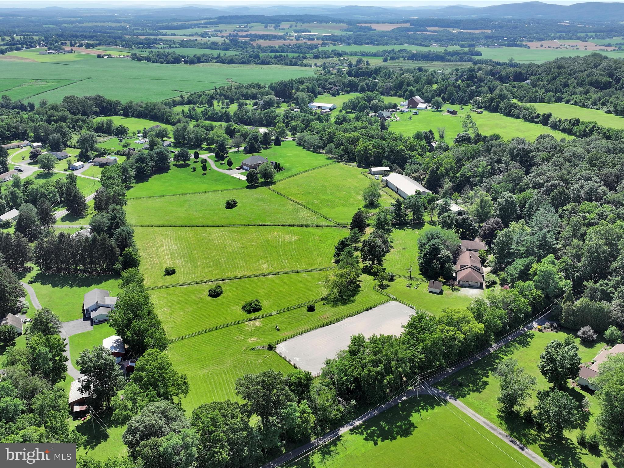 Equestrians...Let's check the boxes here!   Let's set the house aside for a moment...   

Are you going to spend another winter not riding because you don't have an indoor?   Indoor Arena and Outdoor Ring big enough for any discipline.   The entire property is fenced with professionally installed Ever Green Fencing .   Automatic waterers in every pasture.  Room for additional riding rings or to build a cros country course...whatever your heart desires.

The stable has 9 large stalls, tack room, wash stall with hot and cold water and a feed room.   A short walk from the stable is the indoor area that is 65' x 120' with a space at the far end that is 50' x 65' that can be hay storage, additional stalls or a viewing lounge.   

Next stop is an 18' x 40' pole barn with an open bay is perfect for parking equipment and additional hay storage.

Saving the gorgeous home for the finale on this property...
Home is set up to be multigenerational with completely separate living spaces.   In-law suite is 2400sq ft with its own separate kitchen, great room with a fireplace, two bedrooms and two bathrooms.  The master bath is ADA compliant.    If you don't need the additional living quarters, Air Bed and Breakfasts are permitted by right by the township.  Ski Roundtop-6 miles, PA State Farm Show Complex-21 miles,  Carlisle Fairgrounds-18 miles, Gettysburg-26 miles, and Hershey Park 30 miles.
The original part of the home boasts a chef kitchen and open concept dining room and  free standing fireplace.   The  kitchen showcases a  massive custom hickory and granite island, two sinks, a double oven and a commercial sized refrigerator.  The primary bedroom has lots of natural light and an ensuite bath.   There is a large second bedroom with a jack and jill bathroom. 
  Travel Time:
HIA (31 min))
BWI (1hr 40 min)
IAD  (1 hr 50 min)
PHL (2hrs)
Downtown HBG/Amtrak (30min)
Downtown Baltimore (1 hr 30 min)
Lancaster PA (1hr)
Frederick MD (1 hr 5 min)
Swan Lake Stables (40 min)
Diamond 7 Ranch and Arena (7 min)
Penn National Race Course (50 min)