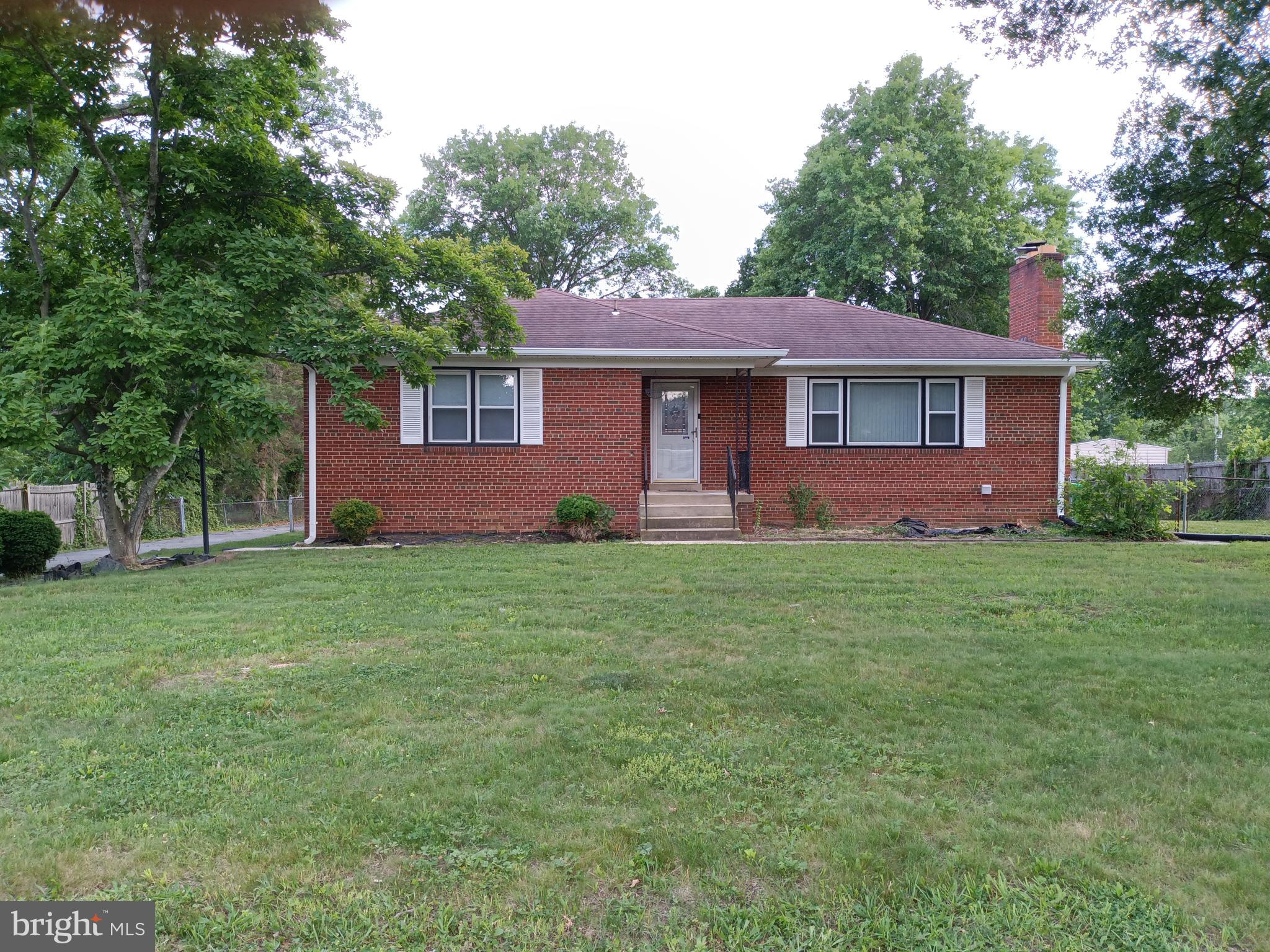 Well-maintained and freshly painted all-brick rambler offering 3 bedrooms, 1 full bath, and 1 half bath on the first level of this charming, functional home. Hardwood floors flow throughout the main level, featuring a bright living room with a cozy wood-burning fireplace and a separate dining room perfect for entertaining. The finished lower level includes a spacious recreation room, full bath, and walk-out access to an incredible fenced backyard. The oversized rear-entry 1-car garage provides added storage and convenience. Enjoy new blinds and ceiling fans in the bedrooms, plus the added peace of mind of an alarm system. The expansive backyard is a rare find — offering endless possibilities for outdoor living, whether you envision a future pool, garden oasis, play area, or the backyard retreat of your dreams. 
Seller prefers Cardinal Title for closing.