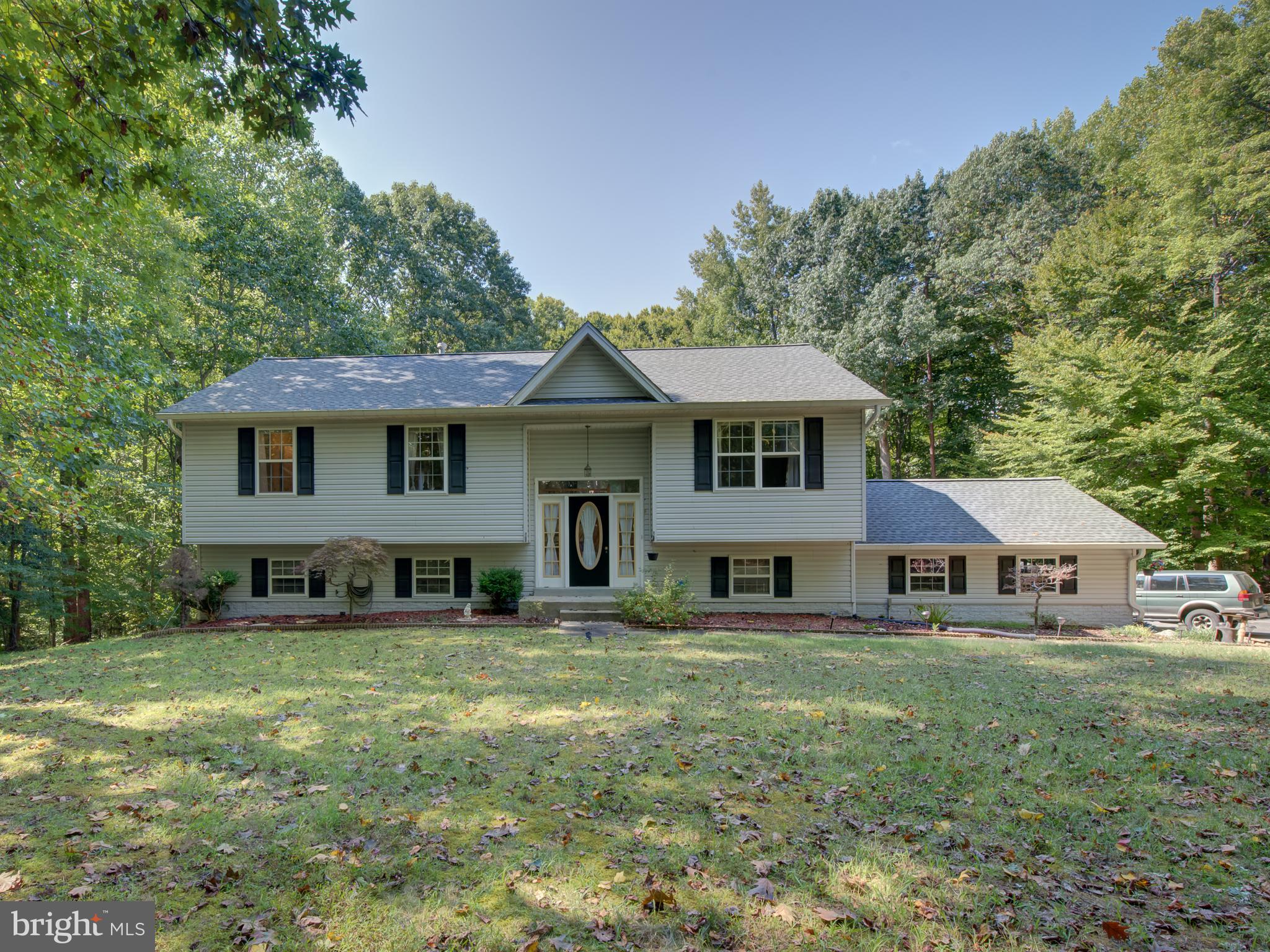 Welcome to beautiful Single family Split Foyer home! This home is ready for a new owners to unpack and settle in.  Roof replaced approximately 2 yrs ago . Main level leads to formal living and dining room and fully equipped kitchen with pantry. From the dining room sliding door leads to netted cover porch to relax with family. The hallway guides you to the Master bedroom with attached full bath with Jacuzzi and good size closet. Specious 2 bedroom with closet and another full bath located in hallway. Good size walkout basement with fireplace and additional bedroom with closet and full bath. Separate room for laundry, storage and utilities. You'll enjoy the fenced and beautiful leveled backyard. House have attached 2 car garage and take advantage to park multiple cars in long and wide driveway (5 years old) . Shed is a bonus for additional storage for a new owners.
