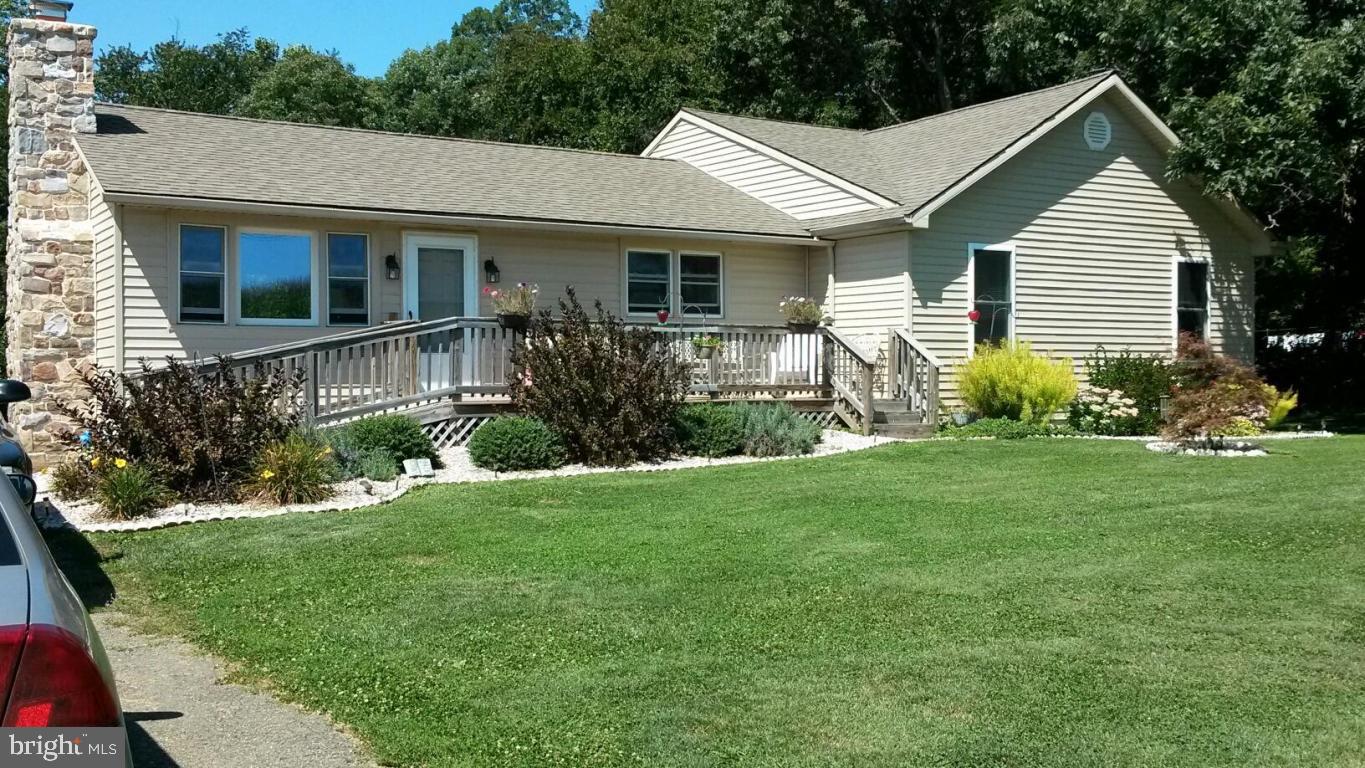 Beautiful views can be seen from this well maintained ranch home. Large master suite with an attached remodeled bath. Basement is partially finished. Detached 20x20 garage & 12x26 shed. This is a must see home!