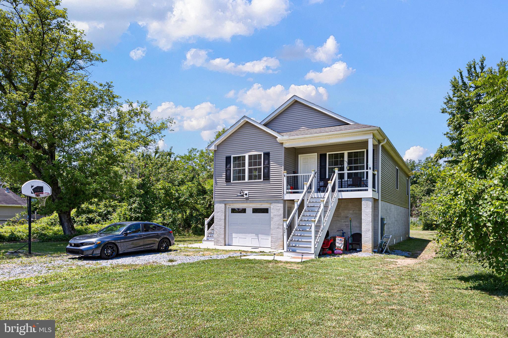 321 West Street in Millington, Maryland is now available for you.  This lovely 5-year-old  home features vinyl siding, three bedrooms and 2 full bathrooms;  Inside, you'll find a formal living room, a dining area, and a fully equipped kitchen with stainless steel appliances, along with a nicely sized island that offers additional space for dining.  The main level also includes a laundry room with stackable washer & dryer included.  Down the spiral staircase to the ground level you'll discover a one-car garage and a full unfinished basement with daylight windows - perfect for extra storage or future possibilities.  Situated on a level rectangular .23 acre lot, this property offers both comfort and potential.  Settlement date is negotiable and we kindly ask for a 1 hour prior notice for all showings.  This home DOES HAVE an FHA assumable mortgage.