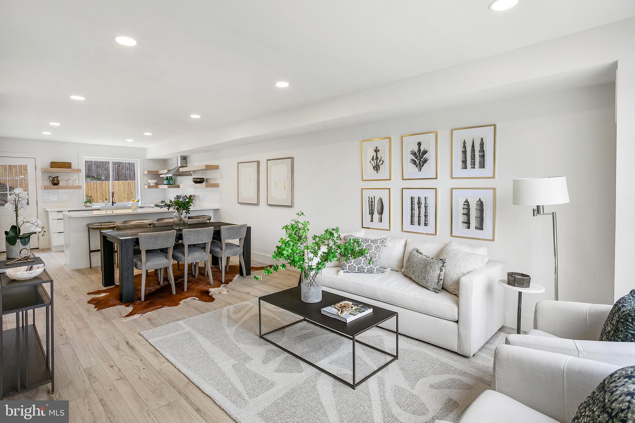 Welcome to 1608 W Street Northeast, a beautifully renovated gem that combines modern flair with classic charm. Step inside to discover a thoughtfully redesigned interior, featuring an open, airy layout perfect for relaxing or entertaining guests. The modern kitchen boasts contemporary finishes, open shelving, and a spacious layout with counter seating and a dining area. The upper level has 3 bedrooms, including a primary bedroom with two closets. The fully finished basement offers endless possibilities, from a cozy lounge to a creative workspace, or additional rental income with its own entrance. There is a private parking pad in addition to ample street parking out, plus a patio and green space in the backyard. Don't miss out on this perfect blend of style and functionality! This home qualifies for the Welcome Grant Program which gives qualified buyers up to $10,000 towards your purchase!