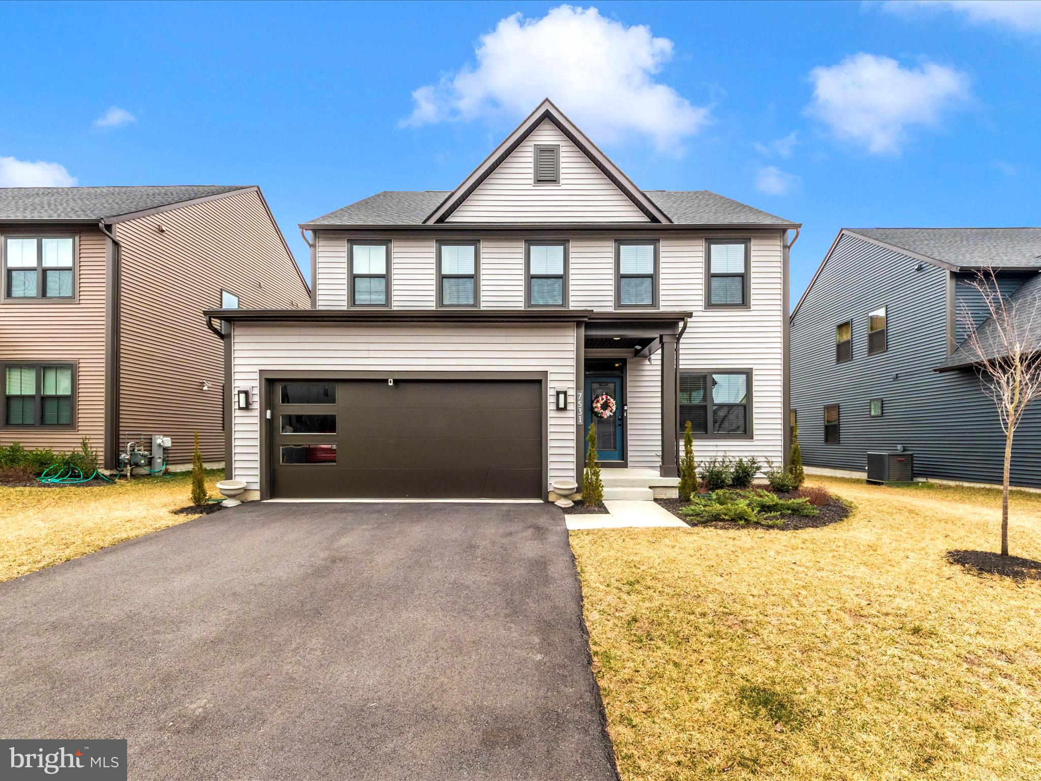 Located in the resort-style Tanyard Shores community, 7531 Blue Sun Dr Unit Columbia is a STUNNING 4-bedroom, 3.5-bathroom single-family home with 3,525 square feet of modern living space and an attached two-car garage (Wi-Fi). This home seamlessly blends style, comfort, and convenience - A MUST SEE!!

Inside, the open-concept design features luxury vinyl plank flooring, fireplace and abundant natural light. The gourmet kitchen is a standout with high-end stainless steel appliances (Wi-Fi), quartz countertops, ample cabinetry, and a spacious island, perfect for both daily living and entertaining. Upstairs, the primary suite is a peaceful retreat with a large bedroom, enormous walk-in closet, and spa-like en-suite bath with dual vanities and a soaking tub. Three additional bedrooms, a full bath, and a convenient upper-level laundry room complete the space.

The finished basement offers a family/recreation room, full bath, and a flex space ideal for an office, gym, storage, or additional living area. Step outside to a large composite deck and expansive backyard, perfect for relaxation and gatherings.

Residents enjoy resort-style amenities at Tanyard Shores, including an exclusive clubhouse, pool, fitness center, yoga studio, coffee bar, indoor/outdoor dining areas, fire pit, dog park, hiking trails, and water access with a dock, boat slips, and kayak storage. Conveniently located minutes from Fort Meade, NSA, I-695, I-97, and Rte. 100, this home provides easy access to shopping, dining, entertainment, and outdoor recreation at Marley Creek and Curtis Creek. Don't miss this incredible opportunity!