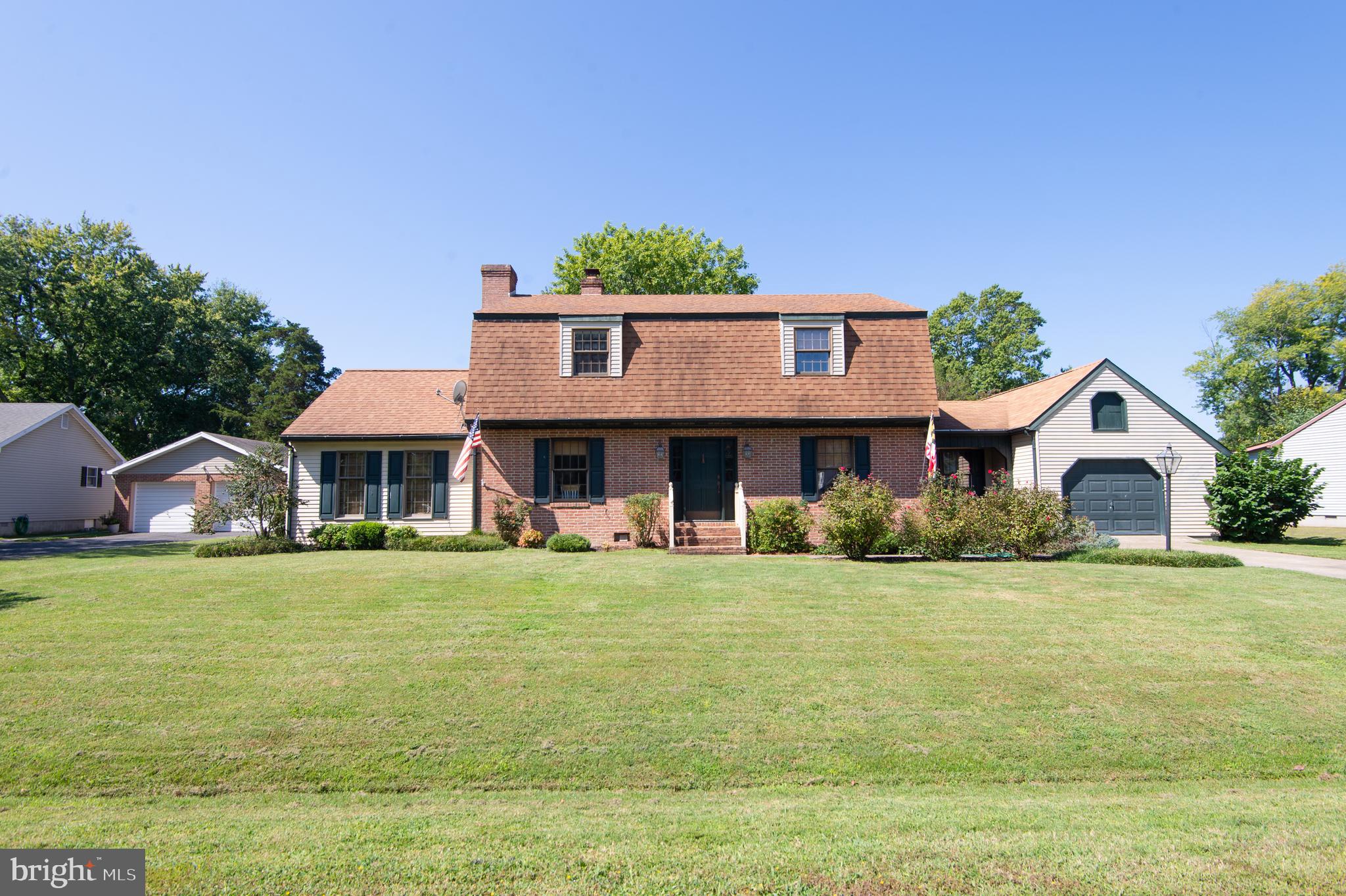 This home just got better - new heat pump installed on the first floor!! Algonquin - stunning Dutch Colonial  featuring three spacious bedrooms and 2.5 baths. The primary bedroom features a beautiful bath and plenty of closet space. Multi levels offer a bright open feel with beautiful wood work, moldings and wood flooring. Gourmet kitchen with granite counter tops and a central island. Formal dining room, living room, den and office. Three fireplaces.  Additional features include a convenient main-floor laundry, an attached garage, and a shed for extra storage. Embrace a peaceful lifestyle and enjoy your morning coffee or al fresco dining on the deck or patio.  The partially fenced backyard is a dream - careful cultivation offers something in bloom and color all year long. The deck has a  retractable awning, there are beautiful brick walkways and patio area plus a firepit.  Water privileged community.