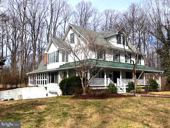 Remarkable 4 Bedroom ---4,163 Sq.Ft Finished Living Space Above Grade --- Beautiful Colonial Family Home located on 5+ PRIVATE wooded Acres in sought after HIATT's RUN Subdivision, at end of a  Cul-De-Sac.  Ready for a new family to enjoy for years to come.
A Curved and Paved Driveway slings through the woods to the home site. A  Flagstone Walkway leads to a Wrap Around Deck with Pine Ceiling.  
Inside:  Lots of unique and customized details. First Level back room has a Custom Tin Ceiling and Wood Panel surround for the wood burning fireplace  - and lots of windows overlooking the back deck/ backyard.   Kitchen has a Brazilian Granite top with Cherry Cabinets and Butlers Sink, overhang Granite Top for   sitting spaces next to the Kitchen Table for those Family Breakfasts - with a huge Panorama Window.  On the other side of the kitchen is a formal Dining Room with French Doors to the Deck - which flows into the large Living Room with Built -In bookcases - all on Red Oak # 2 hardwood floors. Custom wall colors throughout. Ohh, the laundry room is also on the first floor, between the Kitchen and the Fireplace Room and the Top Floor, all finished with a full Bath and a bedroom--AND a space used by the current owners for an ART STUDIO.
Your are greeted with an open sitting space on the second level, and again with large wonders that "takes in the outside".  To the rear is the "blue and paneled" bedroom - with built in drawers and more.  Another bedroom across from a  full and customized bathroom which is next to the Master Bedroom - see pictures...juts very well done.  The master Bedroom is tucked on the side of the second floor- large, quiet and with lots of windows.  3rd floor: Bedroom and ART STUDIO and a full Bath. 
basment: large TANDEM garage plus space for additional yard tools amd mowers, Additionally a LARGE separate room for a workshop etc.  2 NEW electric water heaters installed March of 2023.  3 Bedroom Perc.