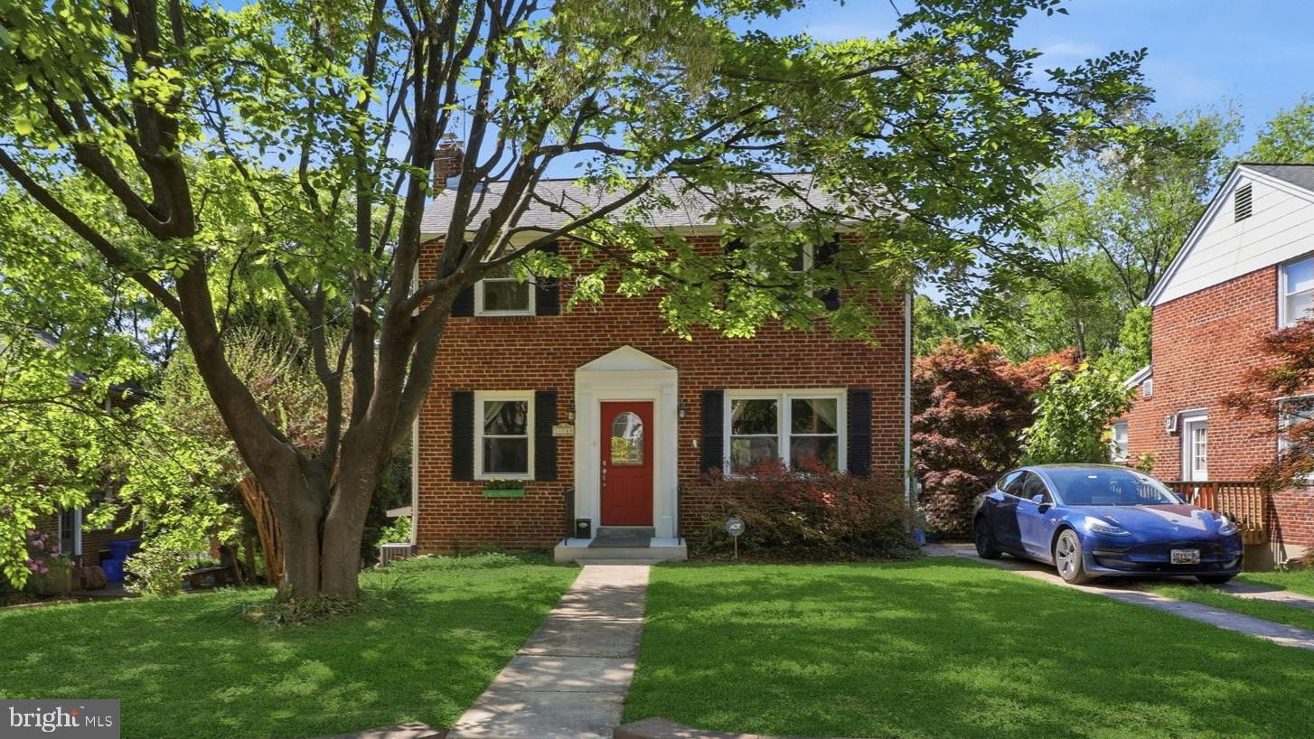 Charming three-level brick Colonial, beautifully updated and full of character. Newly refinished hardwood floors run throughout, creating a warm, timeless feel. The main level includes a welcoming family room with a gas fireplace, a formal dining room, a galley kitchen, and a bright sunroom with views of mature trees, an ideal spot to relax. Upstairs offers three comfortable bedrooms and a beautifully renovated bathroom with elegant travertine and mosaic tile details for a spa-like feel. The finished lower level has a private entrance—ideal for an in-law suite, guest space, or flexible living area—and includes a full bath and laundry room. Outside, enjoy a large rear deck with scenic views of the spacious backyard—perfect for entertaining, relaxing, and year-round outdoor living. The deck was recently refinished, and the interior and exterior have been freshly painted. Well maintained throughout, the windows, doors, and roof have been replaced within the last 10 years for added peace of mind. Additional updates include a 50-gallon gas water heater and an owner-installed outdoor 220V outlet for Level 2 electric vehicle charging. Move-in ready, this home blends classic brick Colonial charm with thoughtful improvements in a beautiful natural setting.