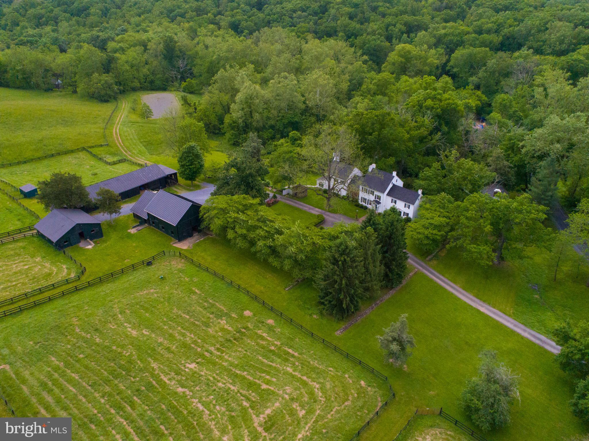 Nestled on 47+ acrs this quintessential hist. brick/stone/stucco Quaker estate astounds.Magnificent home w/plnty of spc for entertaining w/ lrg rms opening to terrace. 2 lvl Au-pair wing w/ sep entr. Fabulous 2 stry gst barn w/wb stove & lovely log cabin overlooking Crooked Run Crk provide plnty of prvcy and tranquility. 3 barns, 20 stalls,5 paddocks & 2 run-in shds complete this equine sanctuary.