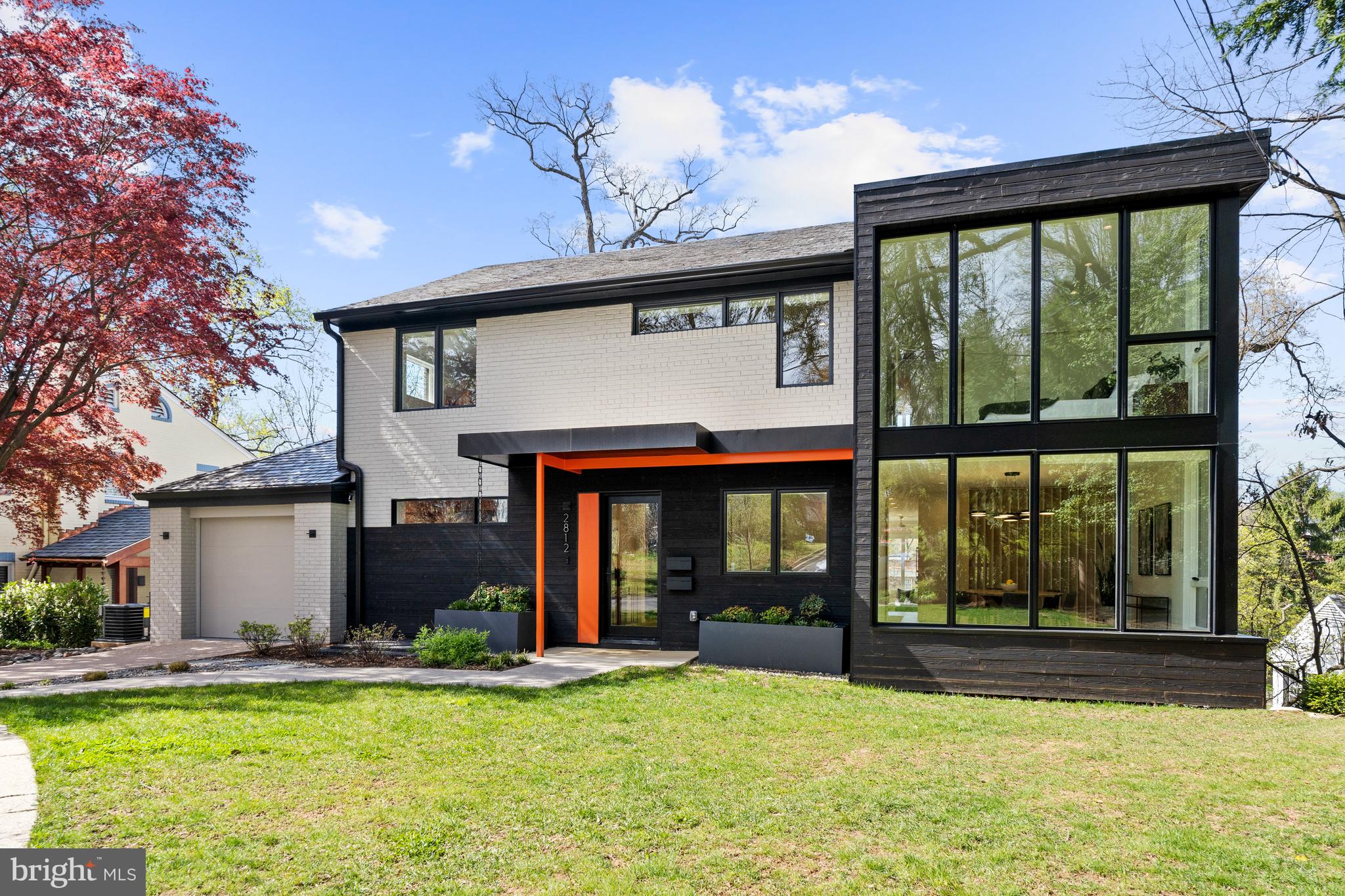 Completely renovated by Kube Architecture in 2020, 2812 29th Pl NW presents a beautifully reimagined mid-century modern home on a private cul-de-sac in Woodley Park. Boasting 5,500 approximate total square feet across 3 levels, the 6 Bedroom, 4 Full Bathroom, 2 Half Bathroom residence showcases a perfectly executed open concept floor plan adorned with custom, designer finishes throughout spacious entertaining spaces and gracious private suites. The Main Level hosts the light-filled principal living spaces to include a Study, formal Dining Room, Gourmet Kitchen, Living Room, Den, Family Room, and Rear Deck complete with a BBQ Grill and scenic vistas. The Upper Level boasts the Primary Suite, 4 additional Bedrooms, 2 additional Full Bathrooms and a Laundry Room. The multifunctional Lower Level features a 6th ensuite Bedroom and a large Recreation Room offering walkout access to the home’s rear Patio and lawn space. A separately metered and fully equipped 2 Bedroom, 1 Full Bathroom apartment is also located on the Lower Level, lending the perfect space for an au-pair suite or potential for a rental opportunity. Discreetly perched off Cleveland Avenue, the contemporary masterpiece lives like a tree house under a canopy of mature trees overlooking Massachusetts Avenue Heights. Complete with a 1-Car Attached Garage and additional Driveway Parking, 2812 29th Pl NW is a unique residence offering all the conveniences of urban living and all the coveted amenities of a suburban lifestyle.
This property is in a sought-after cul-de-sac location and only a short distance to the Woodley Park Metro, the National Zoo, and all of the restaurants and retail of the Connecticut Ave Commercial Corridor, and Dupont Circle just across the Taft Bridge. The location is a short commutes to all of the area’s best private schools.
