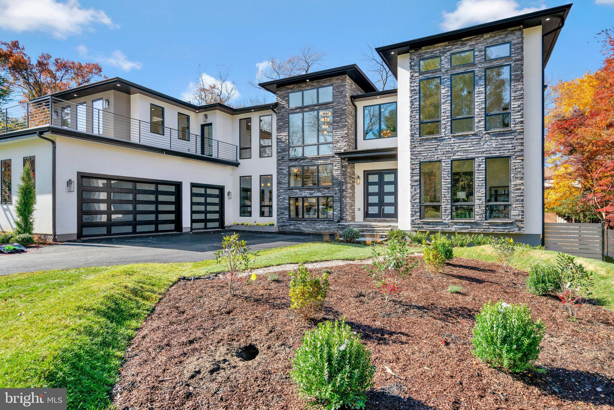 A stunning prairie style home with an open concept floor plan and modern finishes in a highly desirable community in McLean! This fabulous architectural masterpiece home has all the amenities with 8885 square feet of total finished floor area that a family would desire in their dream home. There are 6 large bedrooms, 6 full spacious and luxurious bathrooms, 2 powder rooms, 3-car garage, Pella Lifestyle black windows and walkup basement. Mudroom has a bench, built-in cubbies and a separate dog wash area. Magnificent in every way, spacious, dramatic, refined, and elegant. Upon entering the home, you are greeted by an alluring modern 2-story foyer, living spaces full of natural lights, and solid oak hardwood floors. The spacious formal 2-story great room and stunning dining room offer the perfect combination of elegance and sophistication. Every family's dream in the Gourmet chef's kitchen has Thermador stainless steel appliances and a separate prep kitchen with stainless steel appliances and walk-in pantry. The family lounge is truly spectacular that includes a direct vent gas fireplace with a full wall height backsplash tiles. The thoughtfully designed second floor offers a luxurious owner's suite with a large private balcony, a built-in walk-in closet, a deep soaking tub, TOTO toilet, and a glass shower. The upper level also features 3 additional large bedrooms with full bathrooms. All rooms are generous in size and drenched in natural light. The finished basement includes a modern wet bar with a separate wine storage room, exercise room, 7.2 surround sound speakers prewired media room, and a spacious bedroom with an attached bathroom. Fully fenced massive backyard that is large enough for a pool .