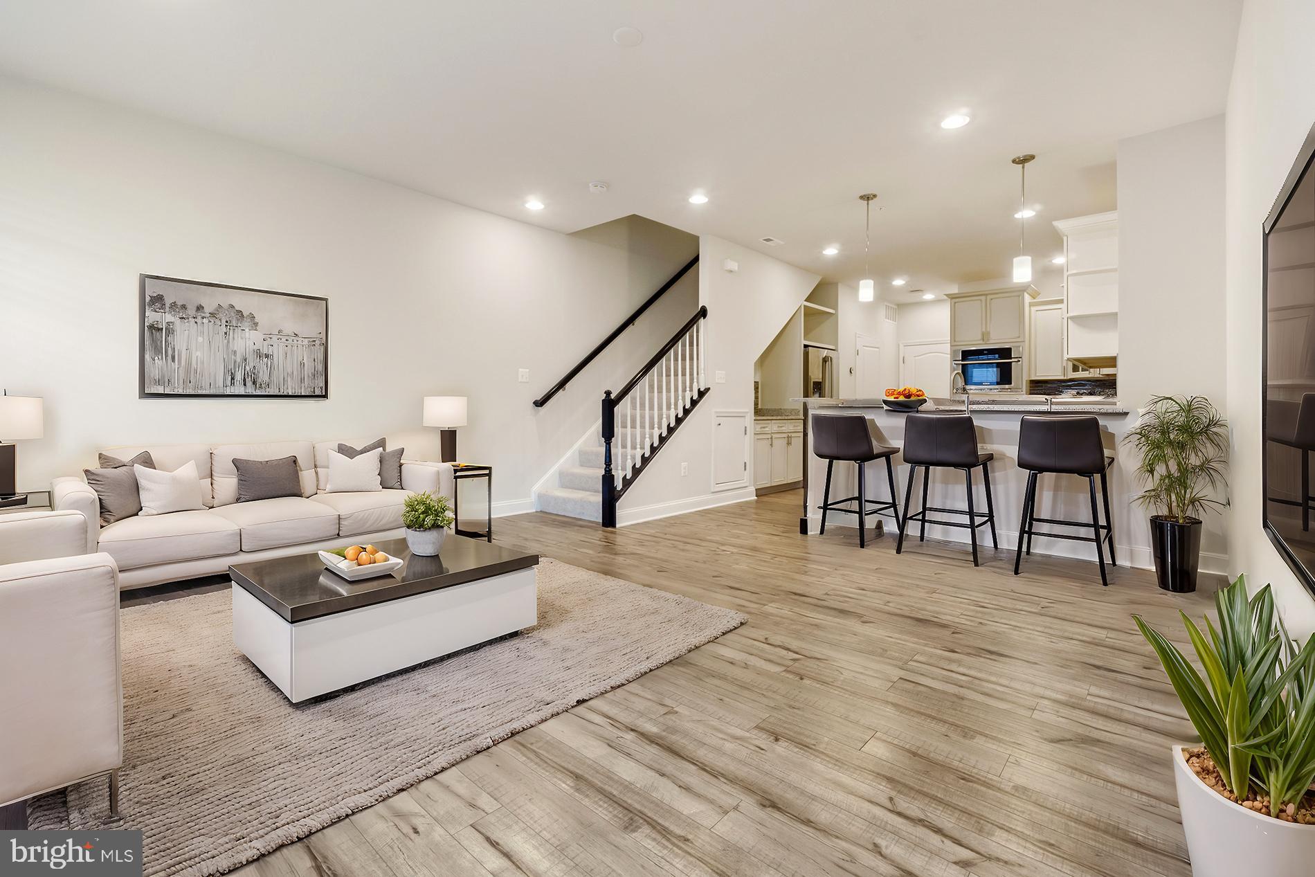 ** New Price ** Welcome to this stunning 3-bedroom, 2.5-bath townhome with a 1-car garage in Howard County’s highly desirable Oxford Square community!
Designed for modern comfort and style, this home boasts a gourmet kitchen that’s a true chef’s delight. Featuring sleek stainless steel appliances, a five-burner gas stove, a built-in oven and microwave, and high-quality cabinetry and countertops, it’s perfect for both everyday meals and entertaining. For added convenience, the garage is located right next to the kitchen, making grocery unloading effortless.
The spacious living and dining areas are bathed in natural light, thanks to large windows that enhance the home’s bright, open feel.
Upstairs, the primary suite features elegant tray ceilings, a private balcony, a beautiful bathroom, and a generously sized walk-in closet.  The laundry area is conveniently located in the spacious hallway on the upper level for easy access. Two additional well-sized bedrooms provide flexibility—ideal for a home office, guest room, or creative space.
This immaculately maintained, move-in-ready home is waiting for you. Don’t miss this incredible opportunity!