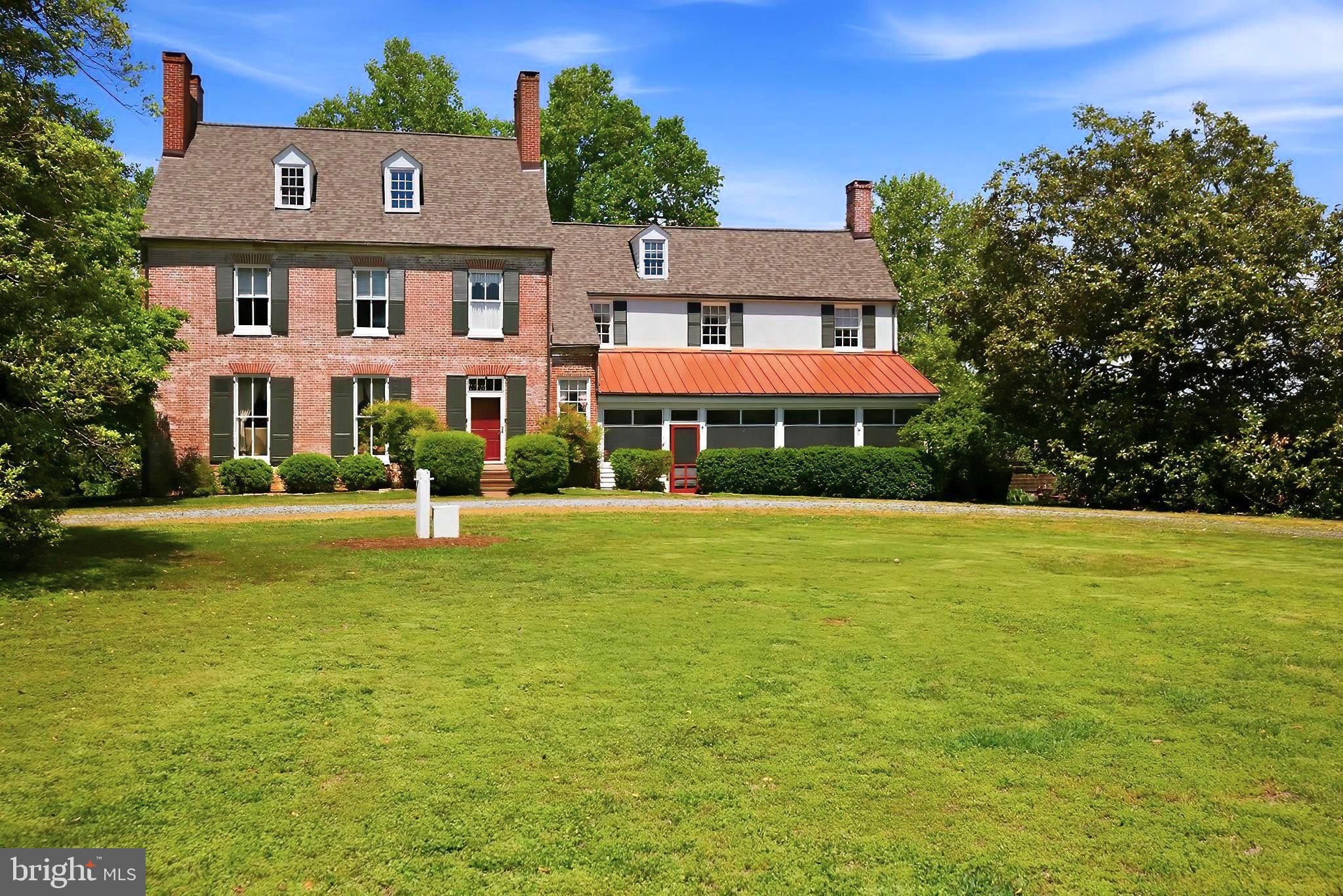 Circa 1743 with a stately 1825 addition, The Inn at Mitchell House is a rare pre-Revolutionary manor home on 9+ manicured acres on Maryland's Eastern Shore. Listed on the National Star-Spangled Banner Trail and just a mile from the Chesapeake Bay, this storied property offers a once-in-a-generation chance to own one of the region's most beloved historic estates.
The grounds unfold past champion and organic fruit trees, a generous herb garden, an original 18th-century smoke house, two private bridges over Stoneybrook Pond which are all framed by woods and rolling farm fields. 
Inside, nine bedrooms and six-and-a-half bathrooms reveal nearly two and a half centuries of craftsmanship: original wood floors, brick floors in the dining room and kitchen, signature Bulls Eye moldings, exposed hand hewn beams, eight fireplaces and soaring 11-foot ceilings.
For more than 40 years the property has operated as a successful Bed & Breakfast. An optional furniture package is available for a seamless turnkey transition. Its origins as a single-family residence also make it an extraordinary private estate, full-time home or weekend retreat. A coveted sewer allotment is included with the sale which opens the door for a future carriage house, barn, additional dwelling, stable, studio or expanded hospitality use.
A new roof, a complete exterior paint job, new hot water heater, new well pump and updated electrical service were completed in 2025–2026. This delivers the rare combination of historic character and modern peace of mind. Tolchester Marina and the Shanty Beach Bar are a mile away. Rock Hall is six miles down the road and the charming historic district of Chestertown is just ten miles away.
After nearly four decades of careful stewardship, the current owners are ready to pass on the privilege and the story of The Mitchell House.