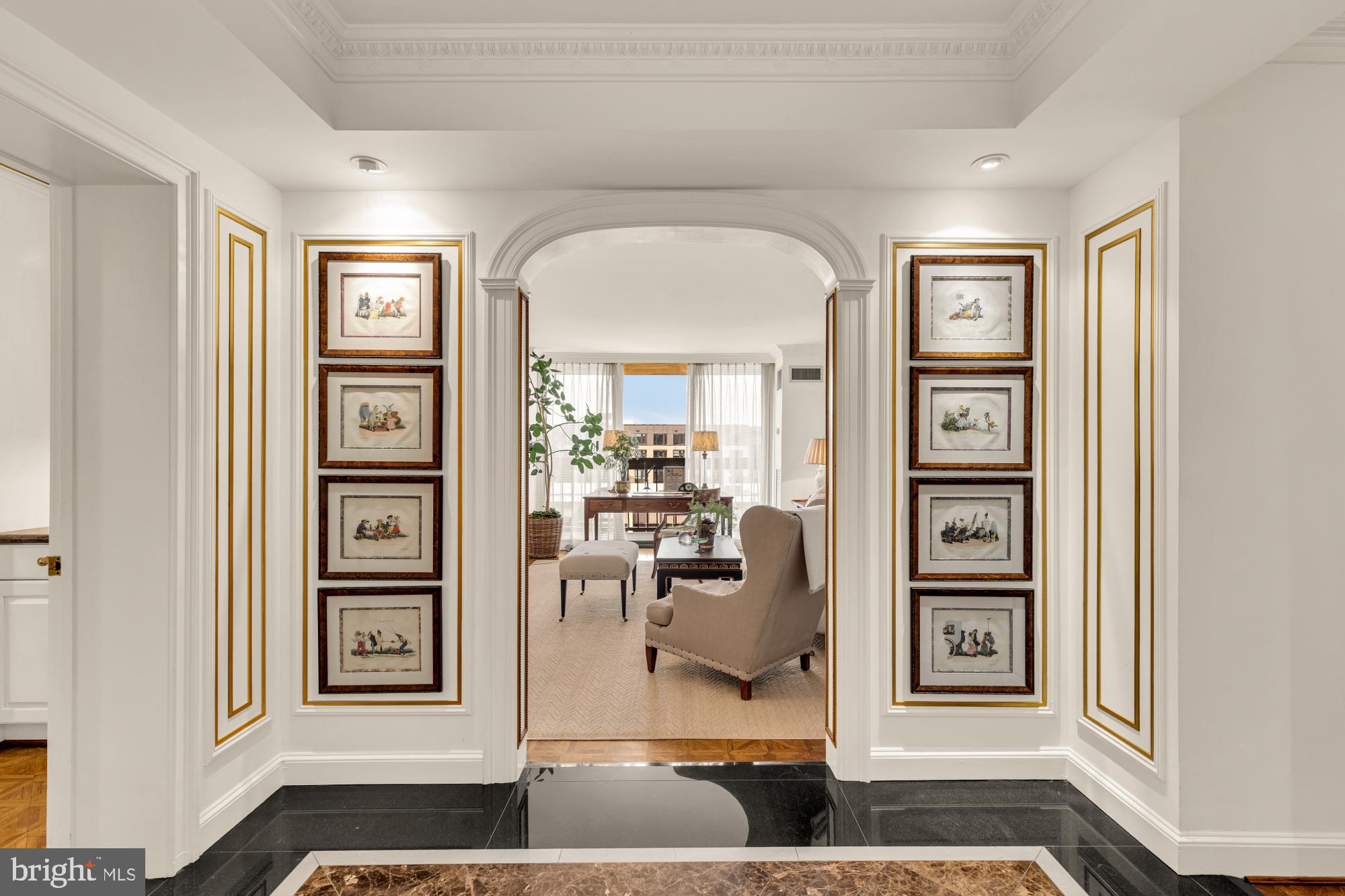 Positioned within the Alexandria House, #501/510 is a masterfully re-imagined residence that represents the pinnacle of luxury high-rise living in the heart of Old Town, Alexandria. This extraordinary 3 bed and 3.5 bath home is the brilliant result of two individual units seamlessly combined into a singular, sprawling sanctuary boasting over 2,200 interior square feet of fluid, light-filled space. Custom-tailored and proudly featured in the pages of Southern Home magazine, every square inch of the property reflects bespoke craftsmanship, timeless sophistication, and a meticulous attention to detail.

Bounded by walls of glass, the space opens to an enormous, (430+ sq ft!) private terrace with river views—a rare high-rise asset that serves as a massive outdoor retreat perfect for al fresco dining and relaxation. Because the home expertly merges two full footprints, it grants the ultimate luxury of abundance—including both a grand formal living room and a separate dining room alongside a highly coveted secondary private entrance. Of the three bedrooms, two include generously sized walk-in closets and en-suite bathrooms. Two large storage units and two garage parking spaces included.

Life at Alexandria House elevates daily living with a robust suite of world-class, club-style amenities. Enjoy exclusive access to the spectacular rooftop pool (complete with dedicated baths and spa), a secondary panoramic rooftop sun deck, and a penthouse-level party and catering room with its own private balcony overlooking the city. The full-service secure building also features a full-time front desk attendant, state-of-the-art fitness room, a quiet resident library, and professional meeting rooms. Combining the scale of a single-family home with the effortless convenience of a luxury condominium building, this turnkey property is a true Alexandria unicorn.