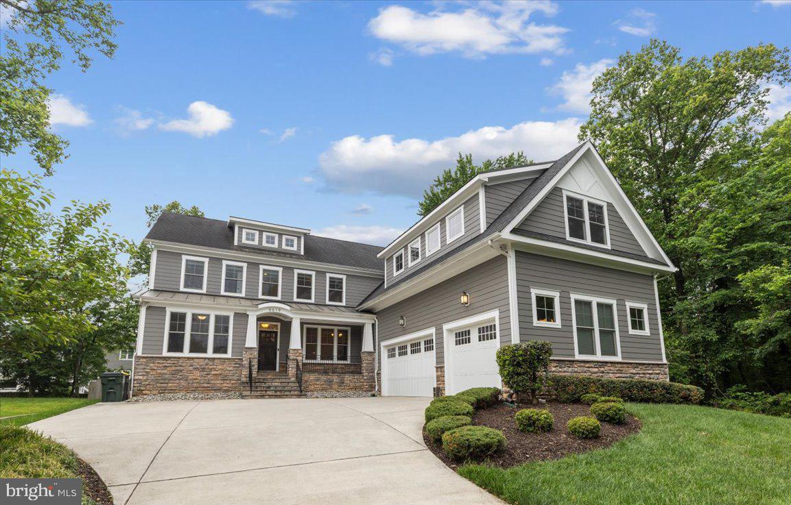 NESTLED on a private cul-de-sac in the heart of McLean, this exceptional Craftsman offers over-the-top comfort, timeless design, and luxurious living across three beautifully finished levels. With 7 bedrooms, 5 full baths and one half bath, thoughtfully designed indoor and outdoor spaces, this home perfectly blends elegance and functionality. A classic, light-filled foyer welcomes you inside, flanked by an elegant living room with custom-built-ins and a dining room featuring beautiful custom millwork.  At the heart of the home, the sun-drenched gourmet kitchen is designed for both everyday living and effortless entertaining, featuring an oversized island with bar seating, quartz countertops, a walk-in pantry, breakfast area, and seamless access to the screened porch for year-round enjoyment. The inviting family room opens to the kitchen and showcases a stunning fireplace with a wall of custom built-ins, tray ceiling, and direct access to the rear deck. A desirable main-level en suite provides flexibility for guests or multigenerational living, while a mudroom, half bath, and access to the attached 3-car garage complete the main level. Upstairs, the luxurious primary suite serves as a true retreat, highlighted by a tray ceiling, spa-inspired bath with soaking tub, frameless glass shower, dual vanities, and an expansive custom walk-in closet. Three additional generously sized bedrooms, each with large walk-in closets, are complemented by two full baths and a spacious media room or private office. A convenient laundry room is on this level with cabinets for storage. The fully finished lower level is designed for recreation and relaxation, featuring a sprawling rec room, dedicated endless pool room, exercise room, additional bedroom and full bath, plus walk-up access to the beautifully landscaped backyard. Outdoor living is equally impressive with a large deck, screened porch, flagstone patio with firepit, and a fully-fenced yard offering exceptional privacy and space to entertain.  Custom programmable automatic blinds in the family room, kitchen, breakfast area, and staircase are thoughtfully designed to open at sunrise and close at sunset for effortless comfort and convenience.  Built by Focal Point Homes. The property backs directly onto Kent Gardens Park and is just a short walk to Kent Gardens Elementary School.  Ideally located near the heart of McLean and Tysons, with easy access to restaurants, shopping, parks, and major commuter routes. Kent Gardens, Longfellow, McLean Schools!