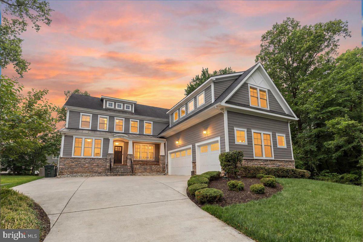 NESTLED on a private cul-de-sac in McLean, this exceptional custom built home offers over-the-top comfort, timeless design, amazing privacy, and luxurious living across three finished levels. With 7 bedrooms, 5.5 Baths, thoughtfully designed indoor and outdoor spaces, this home perfectly blends elegance and functionality. A classic, light-filled foyer welcomes you inside, flanked by an elegant living room with custom-built-ins and a dining room featuring beautiful custom millwork.  At the heart of the home, the sun-drenched gourmet kitchen is designed for both everyday living and effortless entertaining, featuring an oversized island with bar seating, quartz countertops, a walk-in pantry, breakfast area, and seamless access to the screened porch for year-round enjoyment. The inviting family room opens to the kitchen and showcases a stunning fireplace with a wall of custom built-ins, tray ceiling, and direct access to the rear deck. A desirable main-level en suite provides flexibility for guests or multigenerational living, while a mudroom, half bath, and access to the attached 3-car garage complete the main level. Upstairs, the luxurious primary suite serves as a true retreat, highlighted by a tray ceiling, spa-inspired bath with soaking tub, frameless glass shower, dual vanities, and an expansive custom walk-in closet. Three additional generously sized bedrooms, each with large walk-in closets, are complemented by two full baths and a spacious media room or private office. A convenient laundry room is on this level with cabinets for storage. The fully finished lower level is designed for recreation and relaxation, featuring a sprawling rec room, dedicated endless pool room, exercise room, additional bedroom and full bath, plus walk-up access to the beautifully landscaped backyard. Outdoor living is equally impressive with a large deck, screened porch, flagstone patio with firepit, and a fully-fenced yard offering exceptional privacy and space to entertain.  Custom programmable automatic blinds in the family room, kitchen, breakfast area, and staircase are thoughtfully designed to open at sunrise and close at sunset for effortless comfort and convenience.  Built by Focal Point Homes. The property backs directly onto Kent Gardens Park and is just a short walk to Kent Gardens Elementary School.  Ideally located near the heart of McLean and Tysons, with easy access to restaurants, shopping, parks, and major commuter routes. Kent Gardens, Longfellow, McLean Schools!