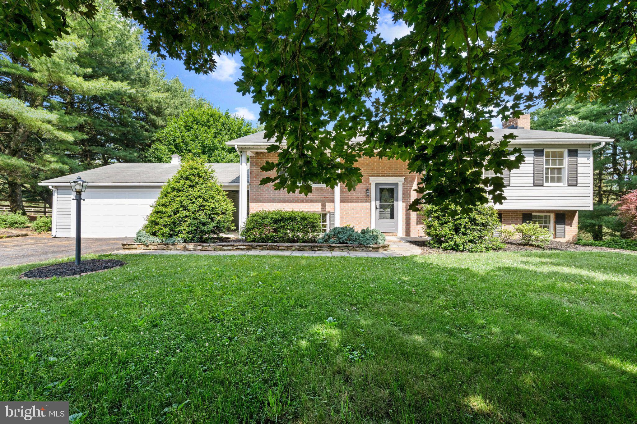 Welcome to this completely remodeled 4-bedroom, 2-full-bath split foyer  with 2 car garage situated on a quiet court in Carroll County. Lovingly maintained by its original owners and beautifully transformed from top to bottom, this move-in-ready home offers the perfect combination of modern updates, quality craftsmanship, and peaceful surroundings.

Step inside and you'll immediately appreciate the extensive renovations throughout the entire home. The stunning new kitchen features quartz countertops, stainless steel appliances, stylish cabinetry, and opens seamlessly to the spacious living room and dining area, creating an ideal space for everyday living and entertaining. New luxury vinyl plank flooring spans the main level, while new carpeting adds warmth and comfort to the bedrooms and lower level. Both full bathrooms have been completely remodeled with beautiful finishes and modern touches.

The main level offers three generously sized bedrooms, a large living room, and an inviting dining area that leads to a gorgeous screened-in porch overlooking the lush one-acre property and peaceful fish pond. Enjoy beautiful views year-round from this relaxing outdoor retreat.

The fully finished lower level provides exceptional additional living space, featuring a spacious family room with a beautiful wood-burning brick fireplace, large bay window, and abundant natural light. A fourth bedroom, second fully renovated bathroom, and laundry room complete the lower level, making it perfect for guests, entertaining, or multi-generational living.

Additional features include the  roof replaced in 2019, a detached two-car garage connected to the home by a convenient breezeway, and a tranquil setting on a quiet court.

This is a rare opportunity to own a tastefully remodeled home on a beautiful one-acre lot that has been lovingly cared for  by the original owners and thoughtfully updated throughout. Simply unpack and enjoy everything this exceptional Carroll County property has to offer.