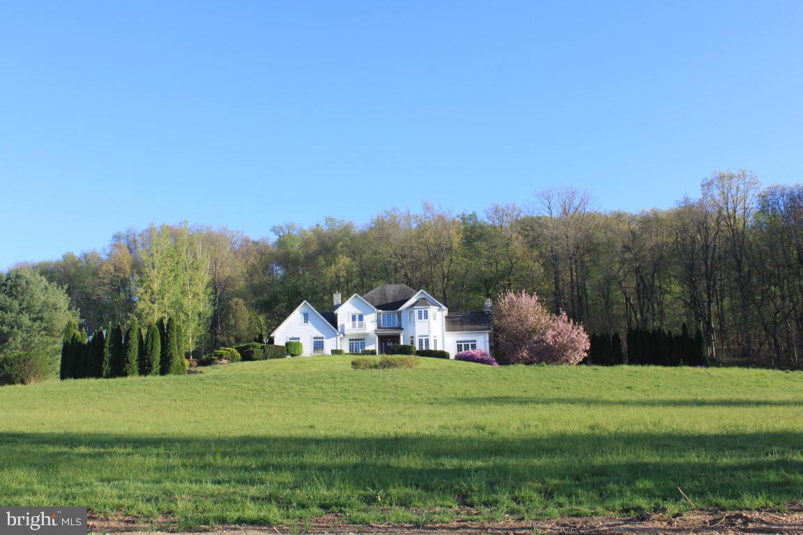 Spacious 4 bedroom home in Penn Manor schools on secluded 4.90 acre lot. Kitchen with 2 ovens, 2 pantrys, large island with sink & breakfast area. Bay window in dining room, wood burning fireplace in family room, 2nd propane fireplace in living room and first floor in law suite.  Master suite with french doors, whirlpool tub, & walk in closet. Great views from all rooms, backyard with berry & fruit trees & convenient location to major routes.