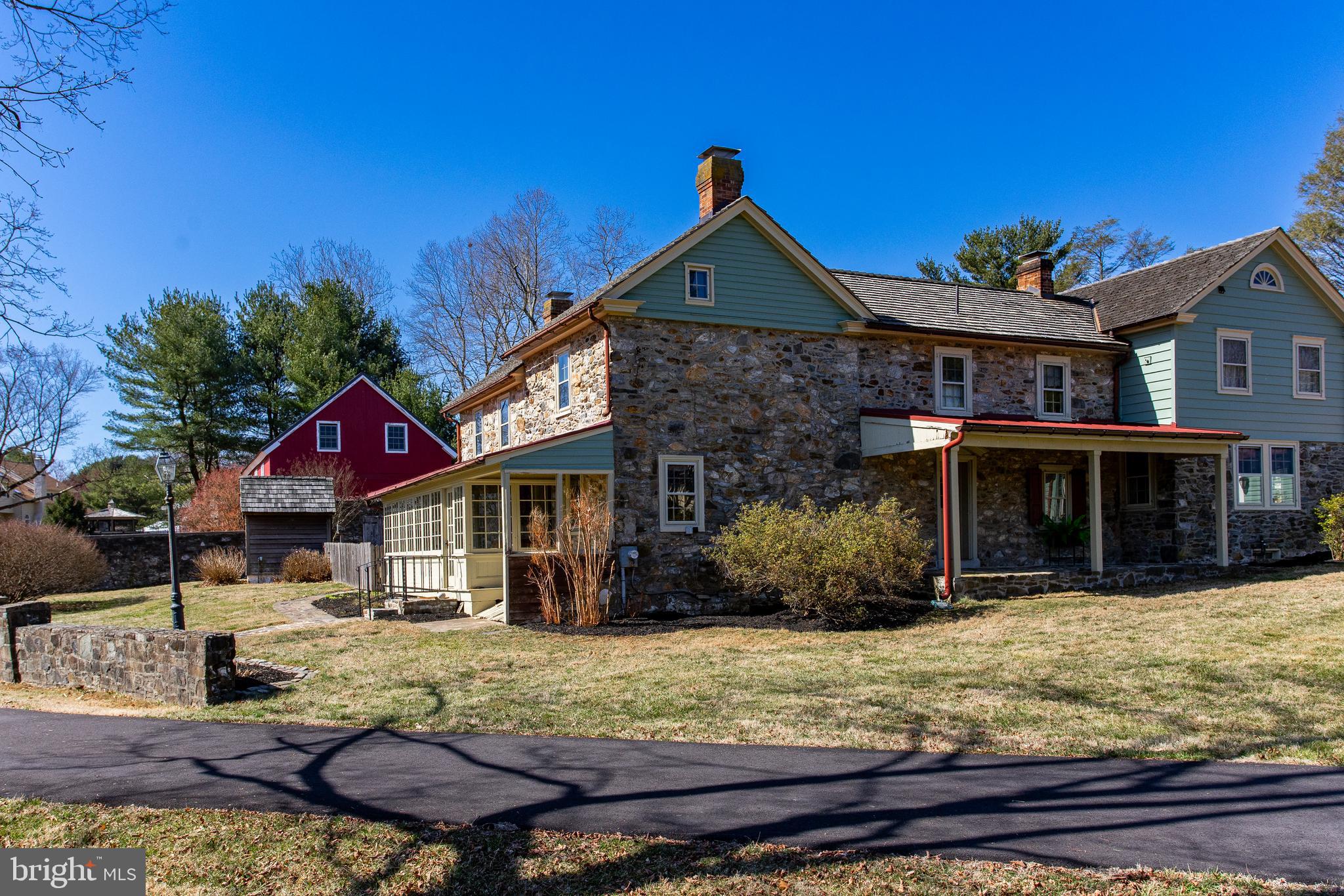Discover the perfect blend of history and modern living in this meticulously restored 195-year-old farm estate, nestled on 2.3 picturesque acres in the sought-after Fairfield community of Chester Springs. Located in the Downingtown East/STEM School District, this unique property offers charm, character, and exceptional versatility.

The Main Farmhouse, built in 1827, features 4 bedrooms, 2 full baths, and stunning period details, including stone exterior, hardwood floors, and three fireplaces—one wood stove, one wood-burning, and one decorative. A spacious second-floor primary suite boasts vaulted ceilings and a luxurious marble bath with radiant heated floors, updated in 2018. The home also includes a cedar shake roof (2012), walk-up attic, and oil-fired boiler/radiator heat.

Complementing the farmhouse is a beautifully designed Carriage House (2564 sq. ft.), complete with 2 bedrooms, 2.5 baths, a full custom bar and entertainment area with a pool table, an oversized kitchen and dining space, and a cozy gathering room with a pellet stove. A new HVAC heat pump (2019) ensures comfort year-round.

For added flexibility, the Guest Cottage (533 sq. ft.) serves as a perfect in-law suite, studio, or home office, offering a private bedroom and full bath.  

The expansive Barn (2016 sq. ft.), built in 2009, features post-and-beam construction, an insulated concrete slab, a large second-floor loft with exposed beams and electric, and three garage doors—ideal for storage, workshops, or hobby space.

Outdoor enthusiasts will love the Sylvan in-ground pool (2012) and Spring House (151 sq. ft.), which currently houses pool equipment.

With public water, on-site septic, and separate utilities for the Farmhouse and Carriage House, this property is designed for convenience and functionality. Whether you're looking for a private family compound, multi-generational living, or a home with incredible character and space, this Chester County estate is a rare find!
