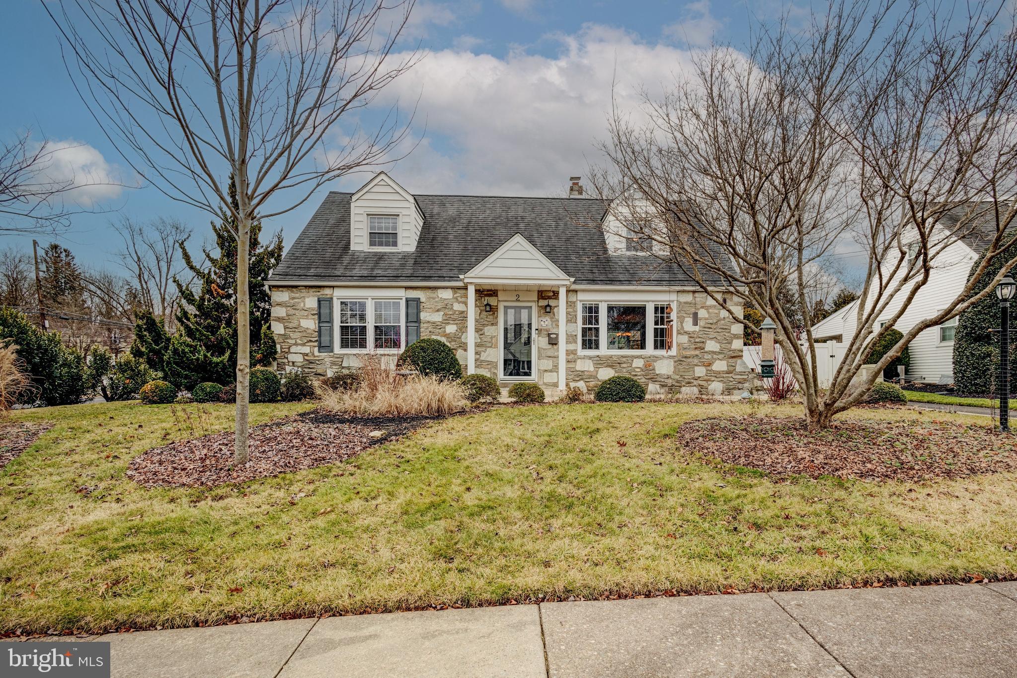 Welcome to this lovely stone-front Cape Cod home in desirable Glenside featuring the coveted Upper Dublin schools. Brimming with natural light and surrounded by meticulous landscaping, this residence offers a comfortable and inviting atmosphere.

Step into the living room with wood floors and a picture window overlooking the front yard. The dining room is generously sized, and the eat-in kitchen features stainless steel appliances and gas cooking. The ground floor hosts two bedrooms and a full bath, making it accessible for easy, one-story living.

Outside, a large brick patio provides a charming space to relax and entertain, with views of a beautiful yard featuring mature perennial gardens and raised beds. A portion of the patio is seasonally covered by an awning.

Storage is ample with a walk-in cedar closet on the second floor, plenty of closet space on the main floor, a waterproofed basement with high ceilings, and an oversized detached garage with additional overhead storage.

Enjoy the convenience of two large driveways for plenty of off-street parking. As a bonus, this home is equipped with a whole-home generator, ensuring confidence during inclement weather.

This home is situated near shopping, restaurants, golf, and swim clubs, with Keswick Village just a short drive away and Septa's Ardsley regional rail station less than a mile from your doorstep. This Cape Cod is not just a home; it's a comfortable retreat in an amazing location. Make it yours today.