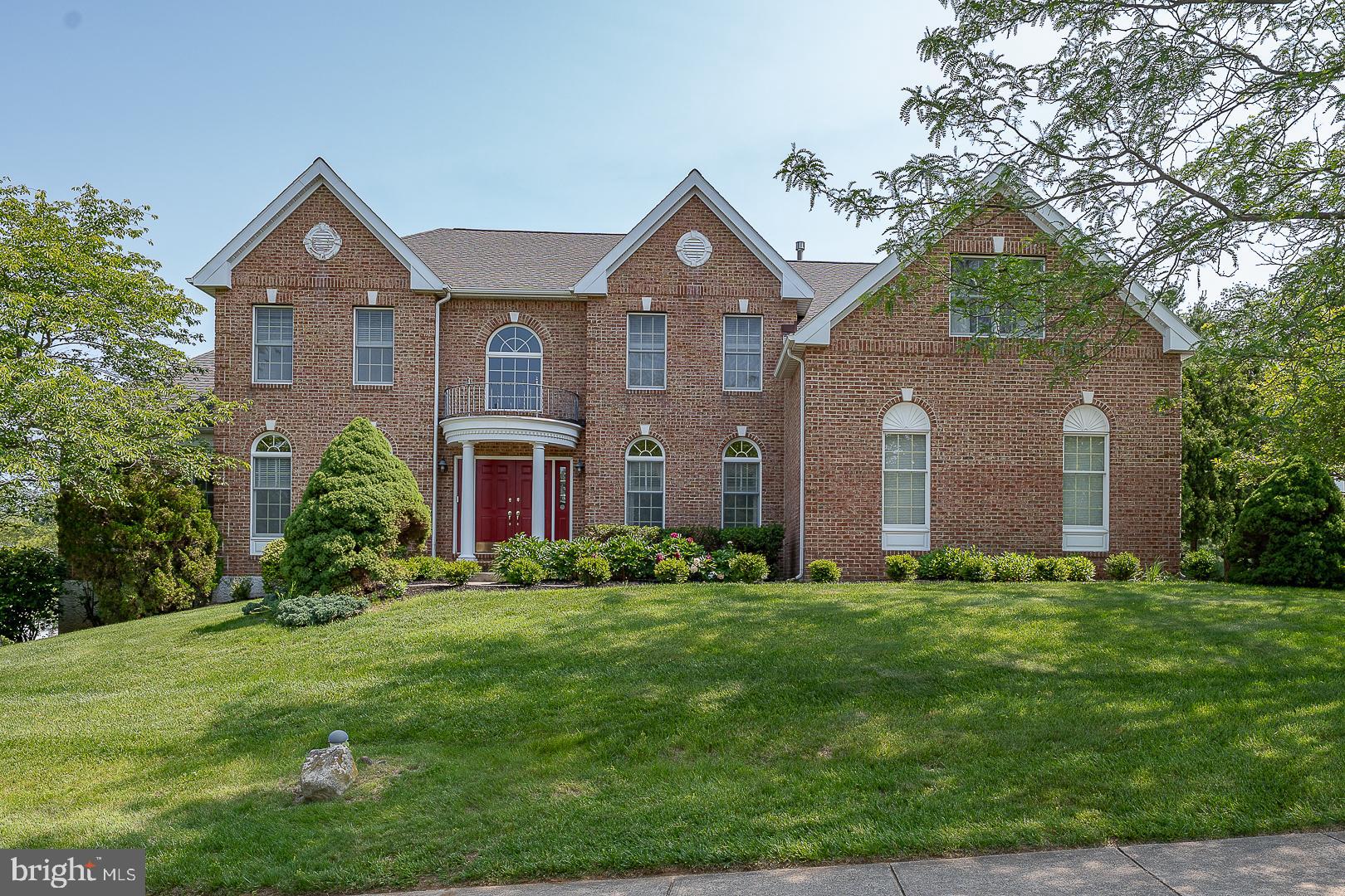 Welcome to 627 Olympia Hills Circle, a spacious colonial with over 6,000 sq ft in the highly sought after community of The Greens @ Waynesborough. Enter this 2-story foyer with a split staircase, hardwood flooring and "picture frame" molding.  The living room and dining room are on either side - the spacious dining room has a tray ceiling, chair rail and crown molding - perfect for entertaining.  To the left is the living room with hardwood floors, crown molding, wainscoting and double doors leading to the expansive game room as well as doors leading to the music room/study. The large Conservatory has a Cherry wet bar, hardwood floors and ceiling fan. The music room or study has a lovely bay window with a window seat. Head to the back of the house, the 2-story family room is clearly the focal point of the home with a beautiful stone gas fireplace, skylights and a ceiling fan. The gourmet kitchen has upgraded stainless steel appliances, including a commercial gas cooktop, double ovens, dishwasher, and refrigerator. There is a large island with granite countertops and an additional island opening to the family room. The spacious breakfast room with a ceiling fan, skylights and a wall of windows overlooks the large wrap around deck. The 1st floor is completed with a powder room and mudroom leading to the 3-car garage with a side door and entrance to the house.  Head up the front or back stairs to a spacious landing with a balcony that overlooks the family room. The spacious Primary Bedroom has a coffered ceiling, sitting room, ceiling fan and three oversized closets - one that was converted to the laundry room.  The Primary Bathroom has double vanities, soaking tub with jets and stall shower.  There is an ensuite bedroom with a double closet, ceiling fan and a bathroom with a tub. Lastly, there are Jack and Jill bedrooms with a bath. Don't miss the amazing walk out basement with a bedroom, full bath, Kitchenette, built-in home office and new vinyl plank flooring - perfect for in laws or guests - their own apartment- they may never leave!!This home has brick and wood siding - NO STUCCO!! It is located in the award- winning T/E School District and is conveniently located to all major highways and everything the Main Line has to offer. A perfect home with all of the amenities for today's lifestyle!