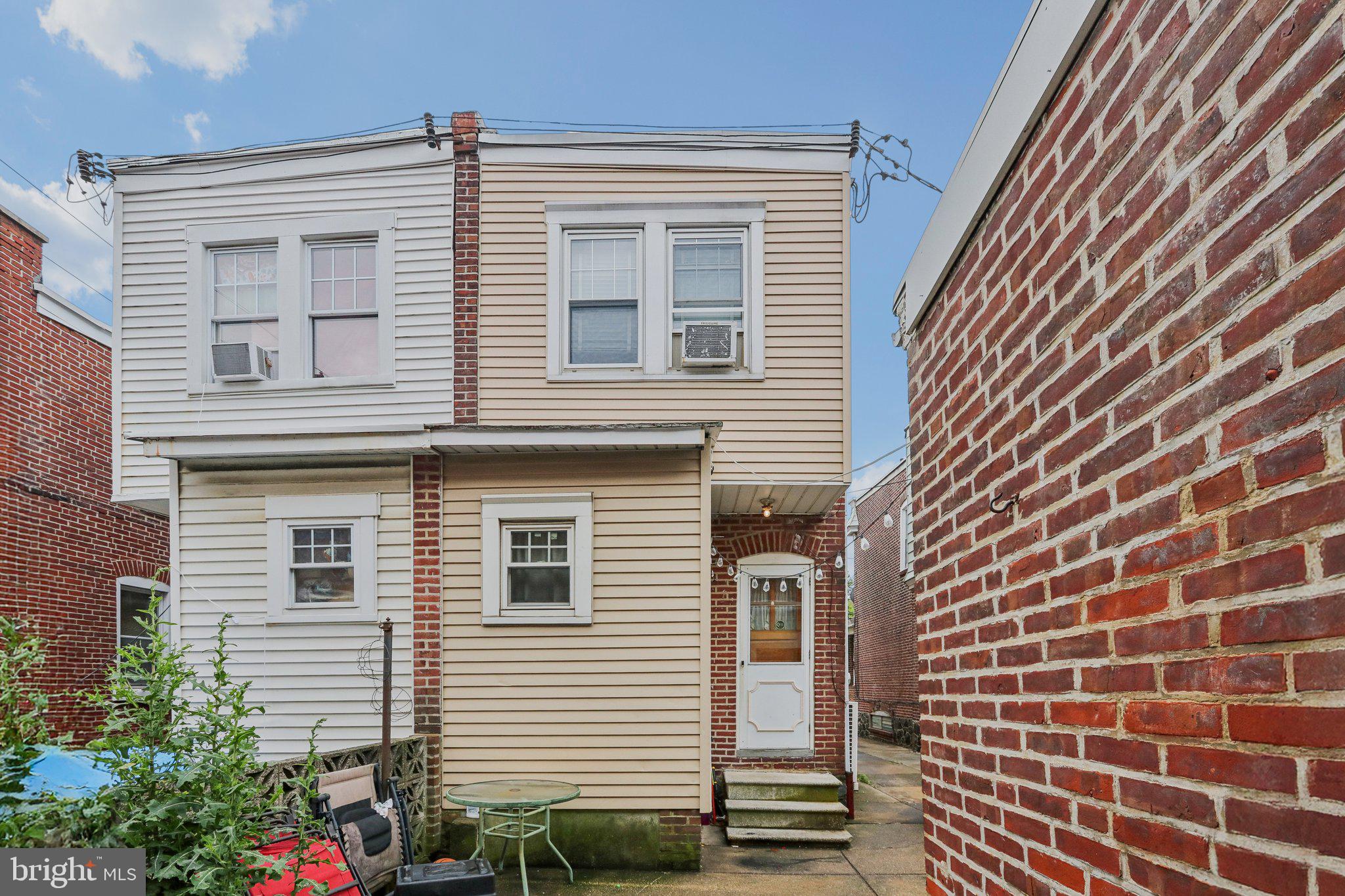 Welcome to this end-of-row rowhome located in the vibrant and historic Little Italy neighborhood. Enter through the enclosed front porch and into a bright and inviting main level featuring hardwood floors that flow seamlessly throughout the home. The spacious living room opens to a formal dining area, creating an ideal layout for entertaining or everyday living. The kitchen boasts gas cooking, a generous walk-in pantry, and convenient access to the rear patio—perfect for summer cookouts and outdoor dining. You'll also enjoy the added bonus of a detached 1-car garage with a shared driveway! Upstairs, you'll find three generously sized bedrooms and a full hall bath. Each room offers ample closet space and plenty of natural light. The full basement is dry and unfinished, offering endless potential—whether you choose to create additional living space, a home gym, or simply use it for abundant storage. Laundry is already in place. This home combines classic charm with functional features and unbeatable location. Just blocks from restaurants, cafes, parks, and everything Little Italy has to offer! Don’t miss your chance to own a piece of this beloved neighborhood—schedule your showing today!