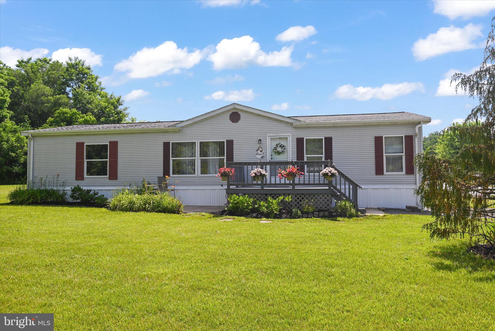 Tucked away at the end of a quiet cul-de-sac in Newberry Farms, this beautifully maintained 3-bedroom, 2-bath home offers 1,568 square feet of comfortable living space. The open-concept floor plan creates a welcoming atmosphere, while the attractive landscaping, front deck, and peaceful setting provide the perfect place to relax and unwind.

The spacious primary suite features a private bath with a soaking tub and separate shower, creating a retreat of its own. All appliances, including the washer and dryer, are included. As an added bonus, the seller is also including a queen mattress and box spring, a sofa, and a countertop microwave.

Located in the Northeastern School District, this move-in-ready home is ready for its next owner. Buyer must be approved by the community prior to submitting an offer. Sewer and trash are included in the lot rent.