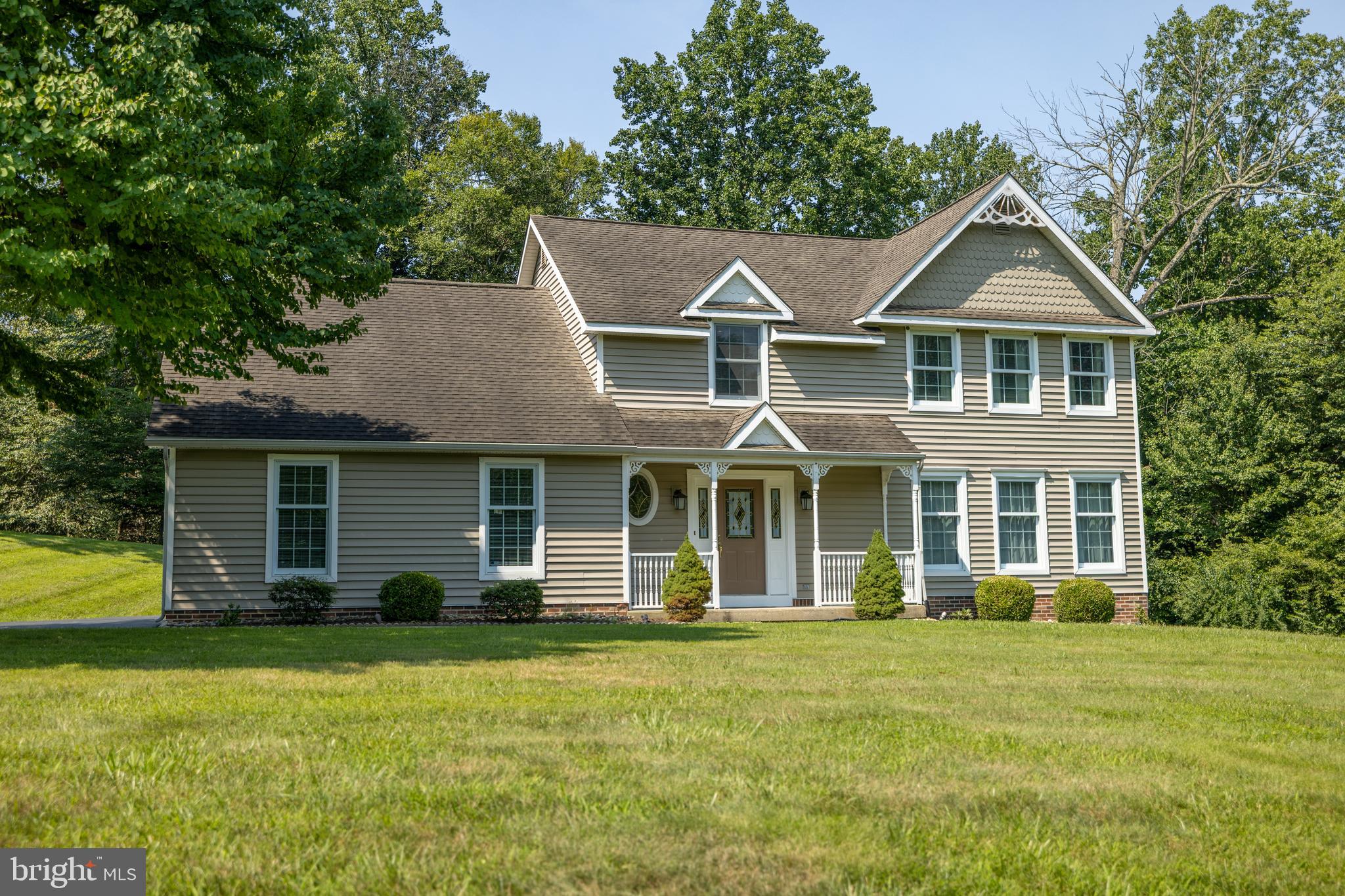 Welcome to 2 Kline Drive in Thornbury Township! Situated on over two picturesque acres in a quiet cul-de-sac community within the highly sought-after West Chester Area School District.  This beautifully maintained four-bedroom, 2.5-bath home offers the perfect combination of privacy, comfort, and many thoughtful updates.  A welcoming foyer with hardwood floors leads into the bright living and dining rooms, where large windows let plenty of natural light in, while showcasing the views of the surrounding property. The formal dining room opens to a spacious Trex deck, creating a great setting for both everyday living and effortless entertaining.  The custom kitchen, renovated in 2019, features porcelain tile flooring, granite countertops, a glass tile backsplash, stainless steel appliances, and a premium Sub-Zero refrigerator. Just beyond, the breakfast area flows seamlessly into an impressive family room, where hardwood flooring, a vaulted ceiling with skylights, and a cozy wood-burning fireplace create a warm and inviting gathering space. Glass doors provide direct access to the expansive rear deck, extending the living space outdoors. A convenient powder room and laundry room, both with porcelain tile flooring, complete the main level.  Upstairs, a spacious primary bedroom offers a walk-in closet and a beautifully updated en-suite bath featuring ceramic tile flooring, a double sink Corian vanity, a glass and Corian-enclosed shower, and a second walk-in closet. Three additional generously sized bedrooms, each with ceiling fans and a full hall bath with another skylight complete the second floor.  A finished daylight basement provides outstanding flexibility with a large recreation room, a separate room currently being used as an exercise room, and a large storage area with built-in shelving.  The oversized two-car garage features epoxy flooring, a utility sink, a workbench, and direct access to a small fenced area in the backyard.  Set on nearly 2½ acres, the property is surrounded by an expansive lawn, mature woods, and a picturesque stream bordering the rear and side of the property, creating a peaceful, private setting. Whether relaxing on the deck, entertaining guests, or simply enjoying the tranquil surroundings, this exceptional home offers the space, privacy, and natural beauty that make it a truly special place to call home.