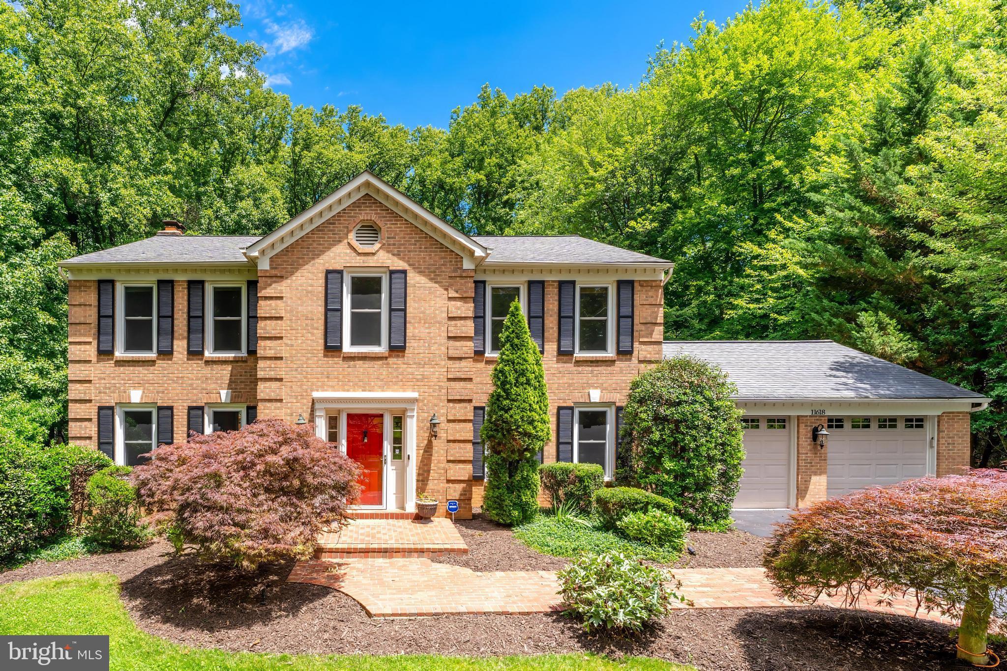 Join us on Saturday, 6/20, from 12-2pm for an Open House.

Welcome to 11618 Holly Briar Lane - tucked away on a quiet cul-de-sac and backing directly to protected parkland, this beautifully updated Colonial offers the perfect blend of privacy, space, and convenience. Situated on a picturesque .88-acre lot surrounded by mature trees, this meticulously maintained home provides the serene Great Falls lifestyle buyers seek, with a large, flat backyard that feels like a private retreat.

A dramatic two-story foyer welcomes you inside, where gleaming hardwood floors extend throughout both the main and upper levels. Classic formal living and dining rooms provide elegant entertaining spaces, while the heart of the home unfolds across the rear of the house. The beautifully remodeled kitchen, featuring granite countertops, premium appliances, abundant cabinetry, and a convenient butler's pantry with beverage refrigerator, opens seamlessly to the breakfast area and family room. Large windows fill the space with natural light and frame peaceful views of the backyard and parkland beyond.

Designed for effortless indoor-outdoor living, the expansive deck serves as a true extension of the home—perfect for morning coffee, alfresco dining, entertaining guests, or simply unwinding while enjoying the privacy and natural beauty of the surrounding landscape.

Upstairs, the spacious primary suite offers a peaceful retreat with a walk-in closet and a beautifully updated spa-inspired bath featuring dual vanities, a soaking tub, oversized walk-in shower, and a skylight that fills the space with natural light. Three additional generously sized bedrooms, a full hall bath, and upper-level laundry complete the bedroom level.

The remodeled walk-out lower level is an exceptional extension of the home's living and entertaining space. Featuring new flooring throughout, a dedicated home theater, expansive recreation room, impressive wet bar, fifth bedroom, and full bath, this level has been thoughtfully designed for hosting family and friends. French doors lead directly to the backyard, while the walk-out design provides abundant natural light and seamless access to outdoor activities and entertaining.

Offering the timeless appeal of a Colonial floor plan combined with today's most desired updates and conveniences, this move-in ready home allows buyers to enjoy the property from day one without the expense or disruption of major renovations.

Residents of Amber Woods enjoy community amenities including tennis courts, playgrounds, and park areas, all within a highly sought-after school pyramid. Conveniently located near Tysons, Reston, Dulles Town Center, major commuter routes, golf courses, Potomac River parklands, and Dulles International Airport, this exceptional home delivers the perfect balance of privacy, luxury, and accessibility.