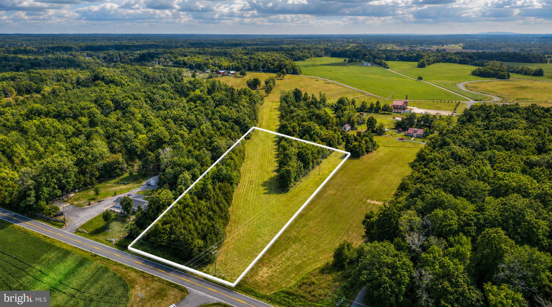 Discover the possibilities with this 2.56± acre parcel in Midland, VA! Nestled in the peaceful countryside of Fauquier County, this Agricultural-zoned property offers approximately 200+/- feet of road frontage and a generally level landscape with a mix of mature growth and natural vegetation, providing a private setting to bring your vision to life.

A buried utility easement traverses a portion of the property, while additional areas may offer the opportunity to explore future homesite and drainfield locations, subject to satisfactory soil evaluations and county approvals. No soil work, survey, or current plat has been completed, allowing buyers the flexibility to conduct their own due diligence based on their intended use. A private well and septic system will be required.

Whether you're searching for a future homesite, a long-term investment, or a chance to own acreage in desirable Fauquier County, this property presents an opportunity to create something uniquely your own. Conveniently located with easy access to Warrenton, Culpeper, and surrounding communities while enjoying the peace and privacy of rural living.