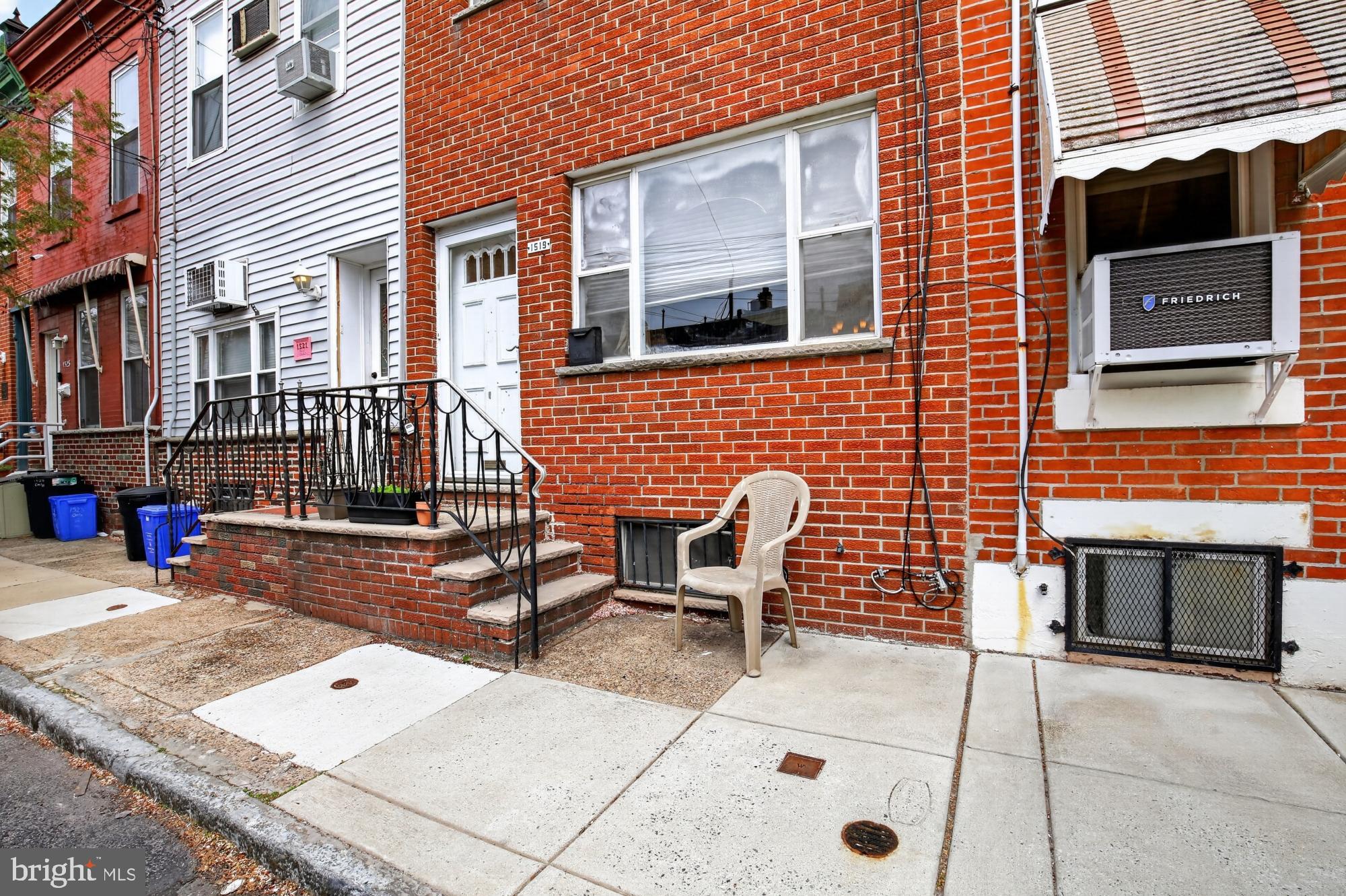 Welcome to 1519 Emily Street, perfectly situated in a highly desirable, walkable South Philadelphia neighborhood. Enter this charming residence into the living room, featuring a large street-facing window that fills the space with natural light. The floor plan provides a seamless flow from the living room through the dining area and directly into the functional kitchen. The kitchen comes fully equipped with essential appliances, including a range/oven, and refrigerator. Off the kitchen at the back of the house is the private patio. Small but mighty, this space is perfect for a cafe table so you can enjoy a meal, a small urban garden of your choosing, or a retreat for your pet. The basement is unfinished and houses the laundry. Utilize the space for all of your additional storage needs.  The upper level is dedicated to the two bedrooms and full bathroom. The spacious bathroom is at the top of the steps and has a tub/shower. The first bedroom is the smaller of the two but easily fits a bed and desk and has closet space. The front bedroom is the larger of the two, has ample closet space, and windows facing South for plenty of sunshine. There is also a hall closet for additional storage. Located just a block from Broad Street, you are steps away from popular local destinations like Melrose Diner, Second District Brewing Co., Vegan Commissary, Starbucks, Station Bar & Grill, and The Thirsty Soul, among much more! Commuting is a breeze with the conveniently close Snyder Station for the Broad Street Line (BSL), offering easy access to anywhere in the city.