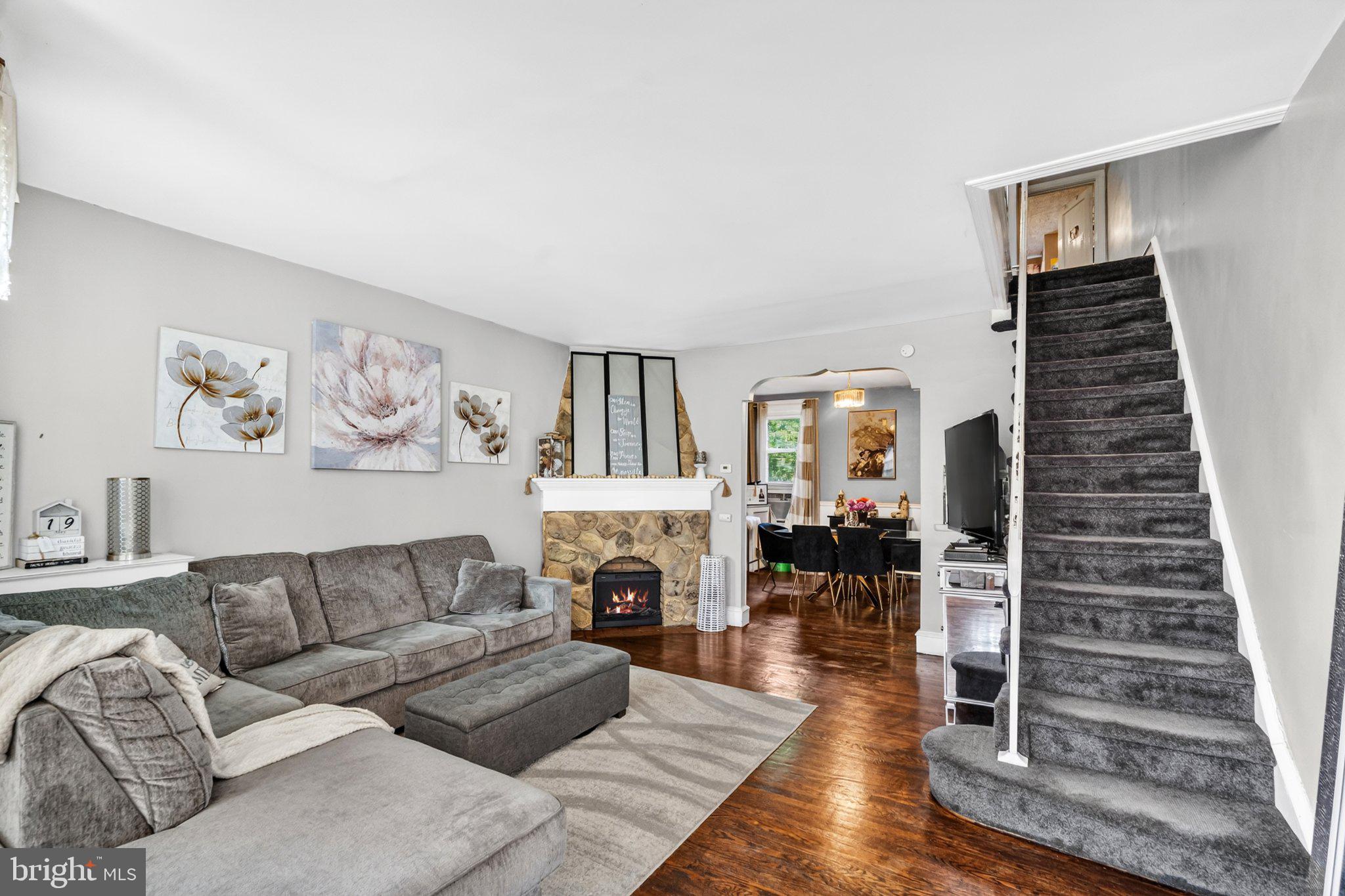 Nestled in the charming Mayfair neighborhood, this delightful 3-bedroom, 1.5-bathroom townhouse exudes warmth and character. Built in 1935, its traditional architectural style and sturdy masonry construction create a timeless appeal. Step inside to discover a fully finished basement, perfect for a cozy family room or a home office retreat. The inviting living area features a fireplace, ideal for gathering on chilly evenings. With 1,364 square feet of thoughtfully designed space, this home offers both comfort and functionality. Enjoy the convenience of an attached garage and on-street parking, ensuring easy access for you and your guests. The low-maintenance lot allows you to spend more time enjoying your home and less time on upkeep. Experience the vibrant community of Mayfair, where local parks and shops are just a stone's throw away. This charming residence is ready to welcome you home-don't miss the opportunity to make it yours! Added bonus: EV car charger.