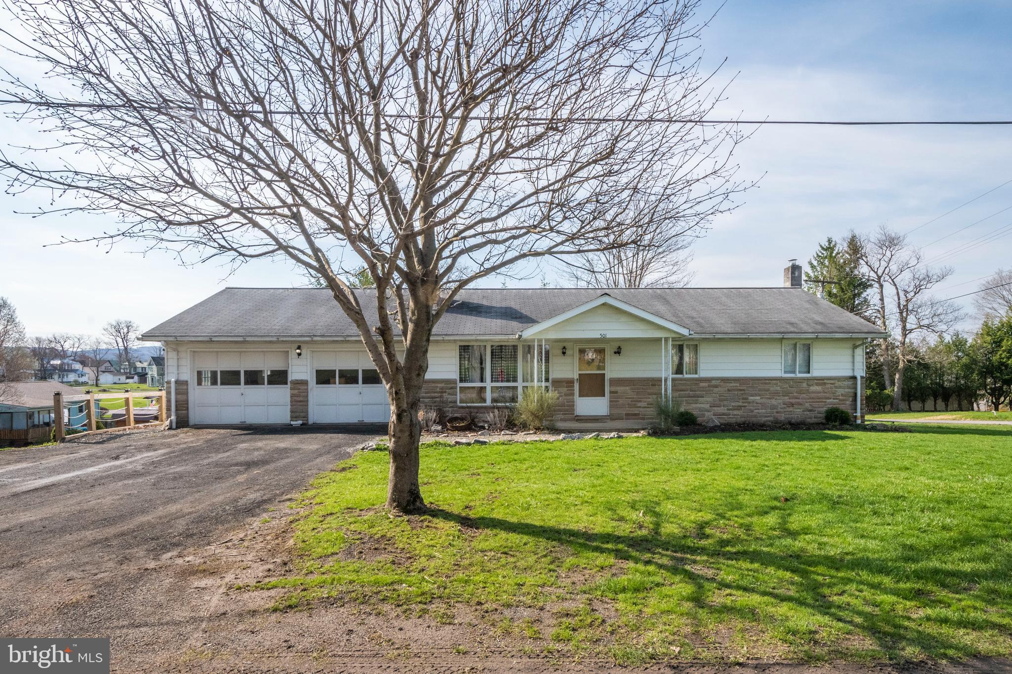 3BR, 1.5BA rancher with 4 total garage stalls - 2 attached, 2 detached. Situated on .28 acres with a fenced backyard, spacious deck and a relatively private setting in Mt Lake Park. Partially remodeled with upgraded bathroom, master suite with electric fireplace, walk-in closet, updated flooring and appliances. 3rd bedroom currently getting a facelift with new drywall accent wall and new closet. 1/2 bath in garage/shop area. Enjoy multiple heat sources: primary heat is a natural gas boiler with hot water baseboard and a fireplace and woodstove as backup options. Full basement with fireplace, perfect for additional living space.
