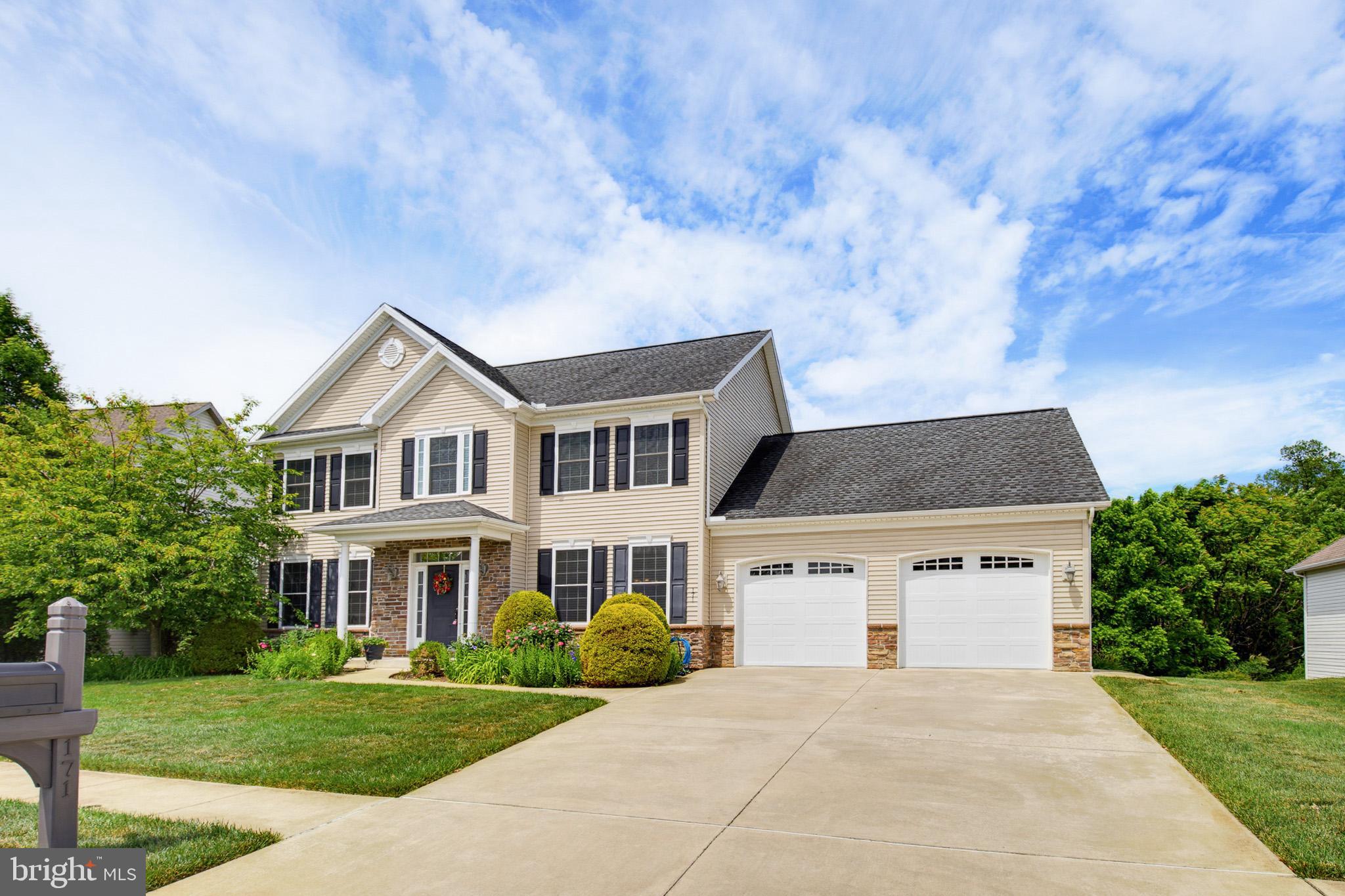 Welcome to Village Cross Creek, where timeless elegance meets everyday comfort. From the moment you arrive, you’ll appreciate the exceptional curb appeal and meticulous care that make this home stand out.

Step inside to a soaring two-story foyer with impressive ceilings that create an immediate sense of grandeur. Throughout the home, you’ll find exquisite craftsmanship, including crown molding, wainscoting, tray ceilings, curved wall corners, and beautiful architectural details that add warmth and character.

The thoughtfully designed main level offers both formal and everyday living spaces, featuring a formal dining room, formal living room, and a spacious family room. The stunning kitchen is sure to impress with granite countertops, a center island, ample cabinetry, and a walk-in pantry, perfect for entertaining or preparing everyday meals. A convenient half bath and attached two-car garage complete the first floor.

Just off the kitchen, sliding glass doors lead to a newer composite deck overlooking the wooded backdrop, creating the perfect place to relax, entertain, or enjoy the peaceful surroundings.

Upstairs, the spacious primary suite features a tray ceiling and a luxurious en suite bathroom with a jetted soaking tub, walk-in shower, double vanity, and generous closet space. Three additional generously sized bedrooms, a full hall bath, and second-floor laundry provide convenience for everyday living. Every step you don’t have to carry a laundry basket counts.

The fully finished walkout basement adds an incredible amount of flexible living space, making it ideal for a recreation room, media room, home gym, office, or playroom, with direct access to the backyard.

Beautifully maintained and thoughtfully designed, this exceptional home offers the perfect blend of elegance, functionality, and privacy in the highly desirable Village Cross Creek community. This is one you won’t want to miss.