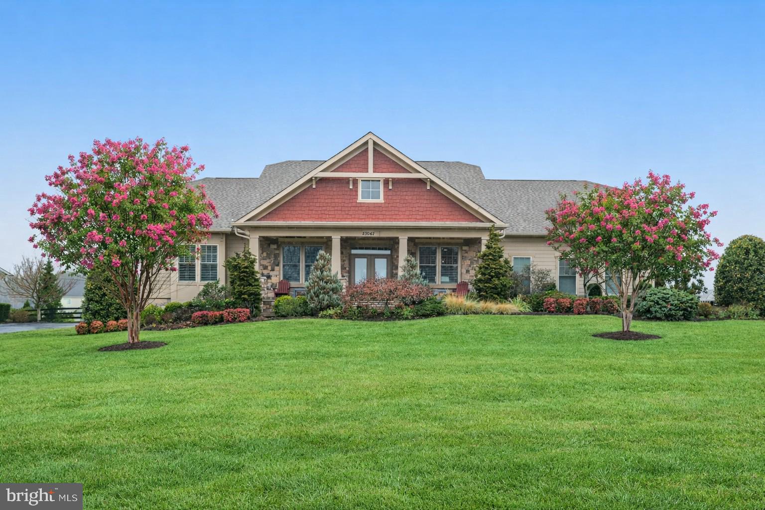 Open House Cancelled - Offer Accepted ....Welcome to this exceptional residence in The Grant at Willowsford, where luxury and main-level living come together beautifully. Built by Arcadia Homes and offering 6,388 square feet of thoughtfully designed living space on a .86-acre lot, this home features high-end finishes, timeless architectural details, and a seamless indoor-outdoor lifestyle.

Designed for both grand entertaining and comfortable everyday living, many of the main living areas open to a private rear courtyard. Highlights include designer paint, custom window treatments, wide-plank flooring, 10’ ceilings, and abundant natural light throughout.

A welcoming front porch leads to an inviting interior featuring a cozy sitting room and a formal dining room enhanced by a stunning climate-controlled wine cellar, creating a unique and sophisticated entertaining experience.

The gourmet kitchen is a chef’s dream, showcasing premium cabinetry, Sub-Zero, Wolf, and Asko appliances, a large center island, custom pantry built-ins, and a bright breakfast area. The adjacent great room features a dramatic floor-to-ceiling stacked stone fireplace, built-in window seats with storage, and beautiful outdoor views.

The private owner’s suite is tucked into its own wing and offers deck access along with a spa-inspired bath featuring heated floors, soaking tub, frameless shower, dual vanities, and a spacious walk-in closet. Two additional main-level bedrooms each include en-suite baths.

The expansive lower "Club"  level is designed for entertaining and flexibility, offering a large family room with gas fireplace and built-ins, a recreation area, and a full-service bar complete with dual-zone wine refrigerator, dishwasher, beverage refrigerator, microwave, and ice maker, plus dining space. This level also includes a generous en-suite bedroom with walk-in closet, a media room, half bath, private office and extensive storage.

Additional features include a main-level laundry room and a three-car side-load garage.

Outdoor living is equally impressive with professionally landscaped grounds, a private level fenced backyard, paver patio, hot tub, and composite deck.

Residents of Willowsford enjoy resort-style amenities including two clubhouses, pools, a fitness center, miles of hiking and biking trails, fishing pond, dog park, zip line, and a working farm. This award-winning community offers the charm of rural living with convenient access to Dulles Airport, major commuter routes, Metro, shopping, dining, and local vineyards—approximately one hour from Washington, D.C.

Schedule your private showing today.