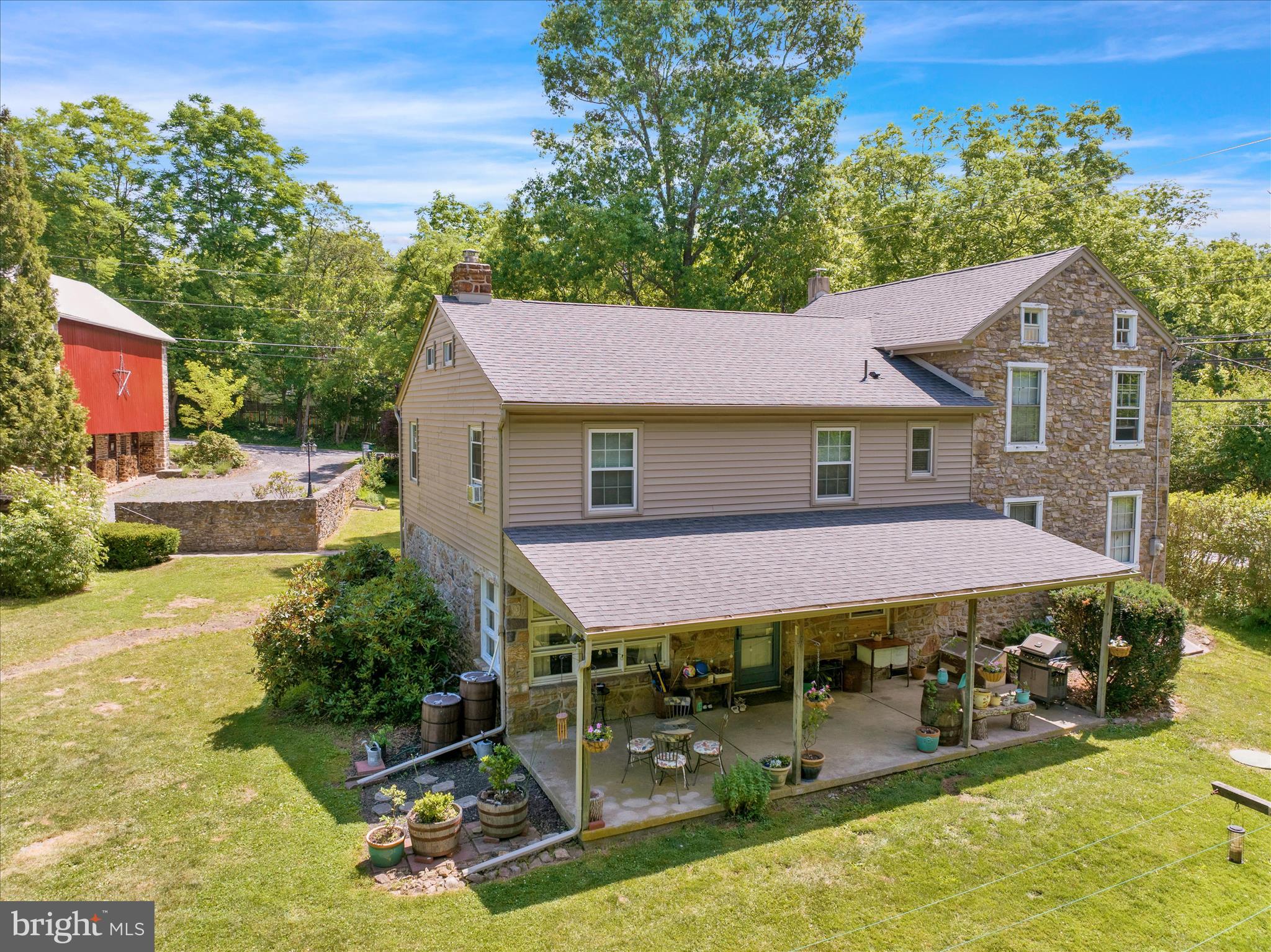 Your dream home awaits! Nestled on over 1.5 acres in the Oley Valley School District, this charming 5-bedroom home offers the perfect blend of country living and modern-day conveniences. Rich in character, the home features beautiful hardwood floors, exposed wood beams, and numerous updates throughout, including a remodeled laundry room, updated electric, newer furnace, renovated full bath, large repointed barn and more. The inviting main level boasts an open floor plan highlighted by a spacious living room with a stunning stone wood burning fireplace, dining area, and a well-appointed kitchen featuring granite countertops and all appliances. A cozy family room provides additional living space, while the oversized laundry room offers custom built-in cabinetry for added storage and functionality. The second floor includes four nice sized bedrooms all with closets and a full bath, with one bedroom ideally suited for a home office, nursery, or hobby room. The third floor serves as a private primary suite complete with a large bedroom, charming deep windowsills, a spacious sitting room, walk-in closet, and a full bath accented by a stylish barn door. Outside, you’ll find a large covered patio overlooking the private backyard, providing the perfect setting for entertaining, relaxing, or enjoying the peaceful surroundings. Garden enthusiasts and outdoor lovers will appreciate the expansive yard with plenty of room to roam. The repointed barn offers excellent storage, workshop space, or parking possibilities. Don’t miss this rare opportunity to own a beautiful country property with modern updates and timeless charm. Schedule your private tour today!