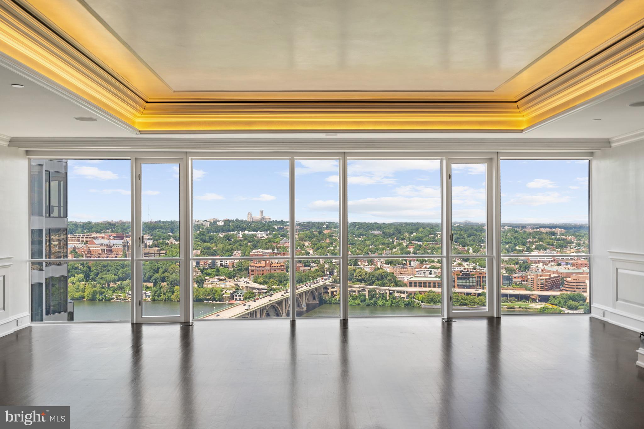 THE HIGHEST CONDO SALE EVER IN THE STATE OF VIRGINIA!
<br>
<br>
THE MOST ICONIC WASHINGTON, DC CAPITAL REGION VIEWS! Astounding three exposures - North, East, and South - offering vistas of all the legendary DC landmarks including The National Cathedral, Georgetown, the Key Bridge, the Potomac River, Roosevelt Island, Watergate Complex, the Kennedy Center, Memorial Bridge, Washington Monument, the Capitol, Jefferson Memorial, National Airport, and the Air Force Memorial. This stunning custom designed penthouse has a direct unobstructed view of all of these!
<br>
<br>
Originally two units, this expansive residence has been newly constructed in 2008 by Peterson & Collins, designed by Rina Yan, and transformed into a sprawling urban oasis showcasing meticulously crafted and thoughtfully appointed living spaces customized with the finest of fixtures and highest quality craftmanship. 
<br>
<br>
Encompassing a very generous 4600 total interior SF, no detail has been left untouched throughout the 3 Bedroom, 3 Full Baths, 2 Half Baths penthouse unit.  Walls of windows with automated shades offer a jaw dropping welcome, debuting breathtaking views of DC’s most coveted treasures.  Bespoke design notes to include custom millwork, hand-painted and silver leaf 8’8” tray ceilings, hand-stained wood flooring, Lutron lighting system with motorized privacy shades and beautiful built-ins, span the home’s graceful interiors to offer luxurious, yet effortless living. 
<br>
<br>
The spacious primary living spaces are designed to highlight the home’s focal point, its remarkable city views, and offer functional entertaining and dining settings. The Gourmet Kitchen includes Clive Christian walnut cabinetry, double bevel marble counters, Sub-Zero refrigerator & freezer, Wolf Cooktop and Double Ovens, a Built-In Microwave, integrated pantry, and is seamlessly appointed adjacent to the Dining and Living Rooms which also include built-in speakers. 
<br>
<br>
Custom wood panels and silk upholstered walls line the hallway to the Primary Suite. Showcasing a hand-painted tray ceiling, two expansive dressing rooms adorned with Clive Christian cabinetry, island storage, outfitted shelving, and a spa-like Bath complete with double Sherle Wagner vanity, crystal quartz counters, walk-in shower, Waterworks bathtub, integrated TV/Vanity mirror, view of the Washington Monument, this suite is a true respite within the residence. An additional Bedroom is located down the hall and features a walk-in closet and en-suite bathroom with marble & glass shower. A Library and large Laundry Room with additional storage complete this impeccable Penthouse’s offerings. 3 Assigned, Underground Garage Parking Spaces and Storage space convey with the unit. Throughout the extensive, year and a half long, new construction process, the duct work and plumbing systems have been reworked, UV Solar window film has been applied to all windows and HVAC registers have been concealed with custom applied crown molding. Residences of the Waterview Condominium building can enjoy 24/7 Concierge full services along with use of the building’s Fitness Center, access to the Le Meridien Hotel, and roofdeck with gas grills on the 31st floor overlooking Washington, DC. The building’s condo fee is $5,130 per month. Room service by Le Méridien  is available to owners at The Waterview
